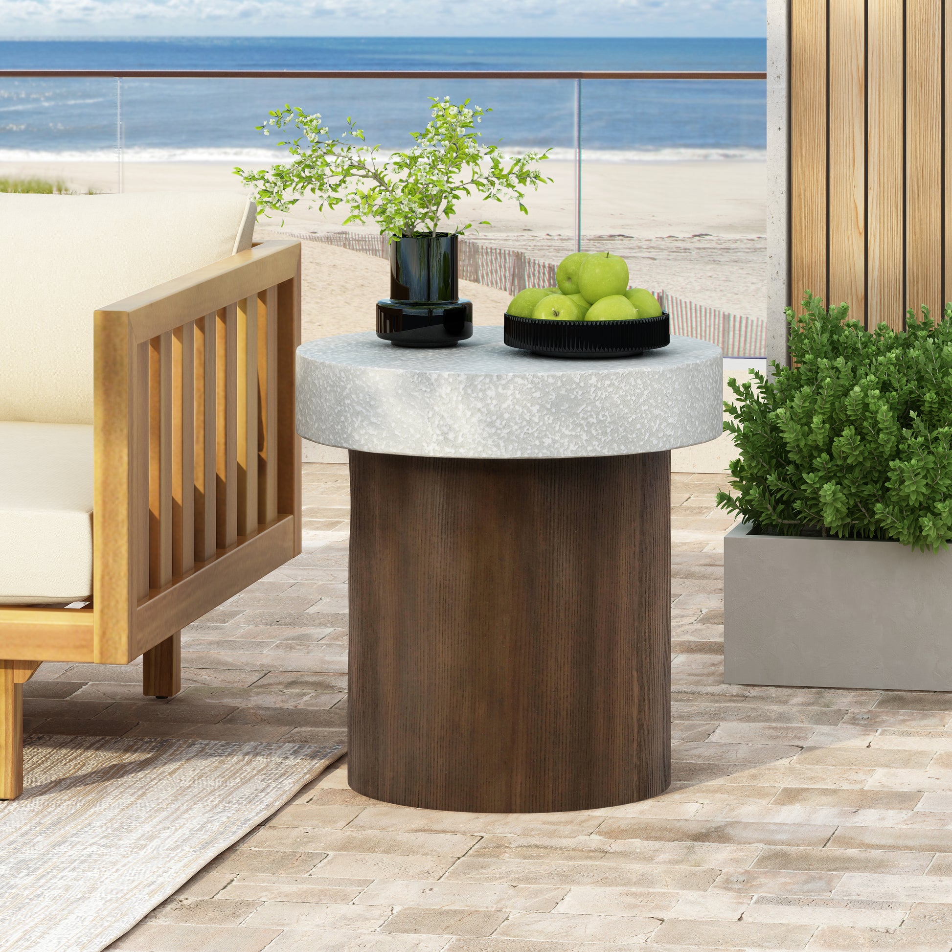 Round concrete and wood outdoor accent table with apples