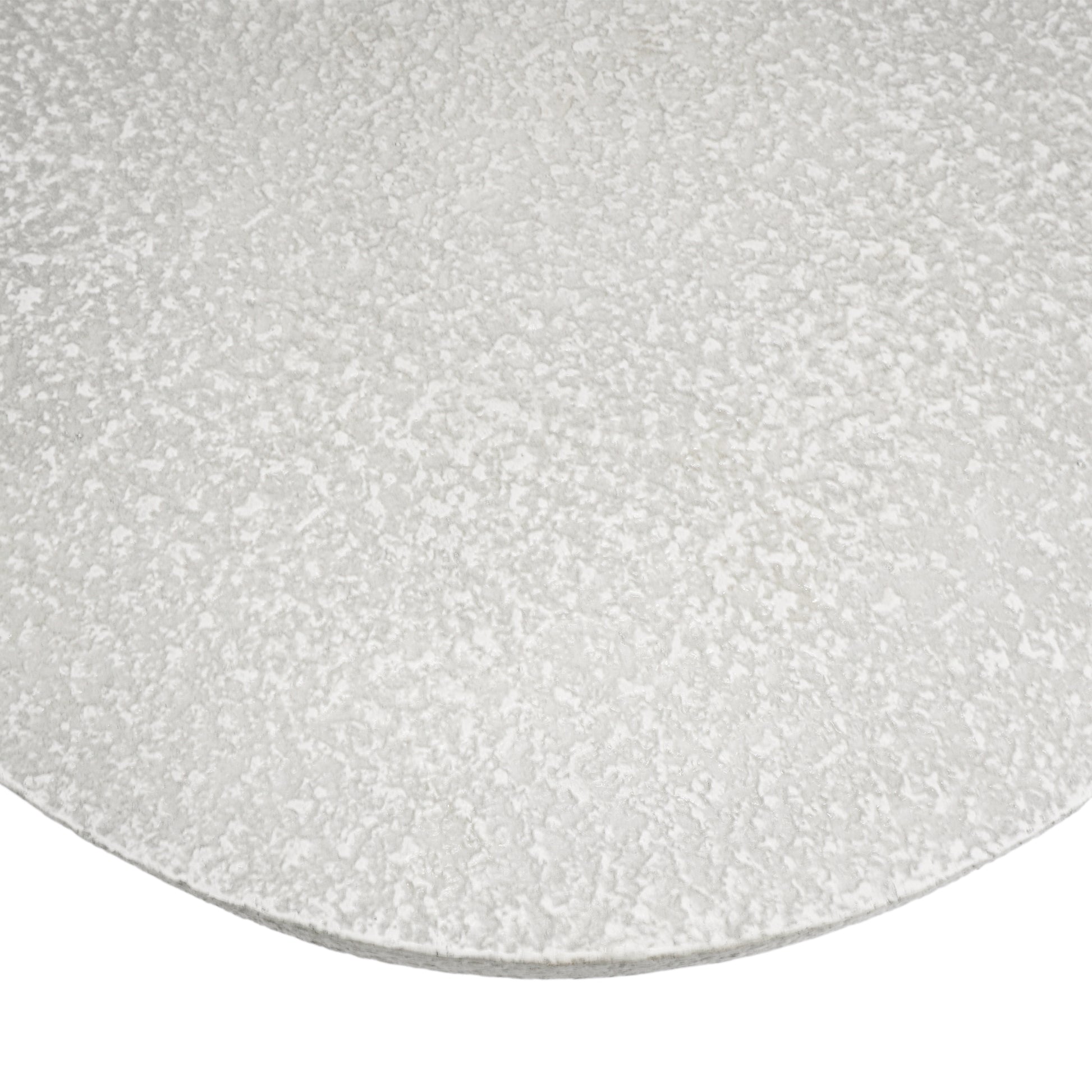 Textured white ceramic plate with speckled finish
