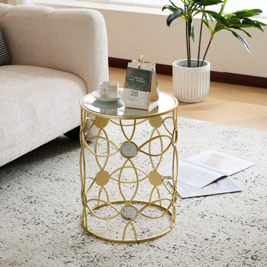 Gold metal accent table with mirrored inlays and glass top