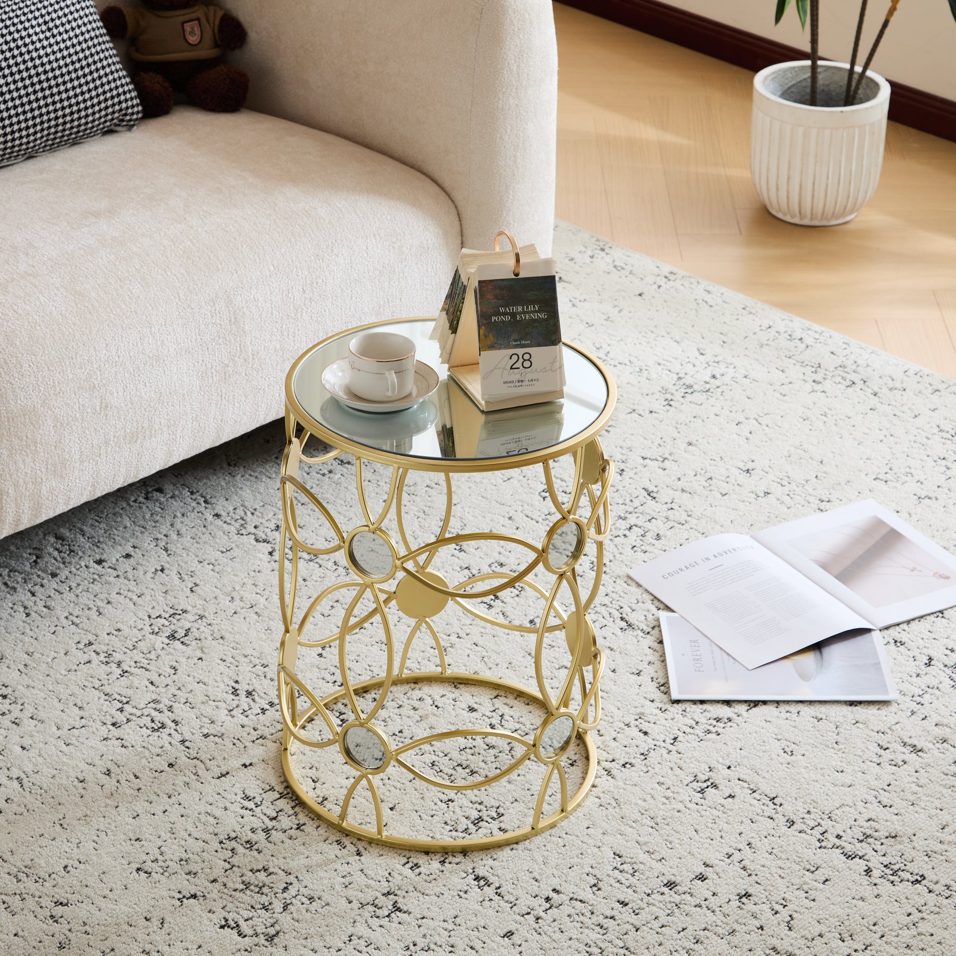 Gold accent round side table with mirrored top and intricate metalwork