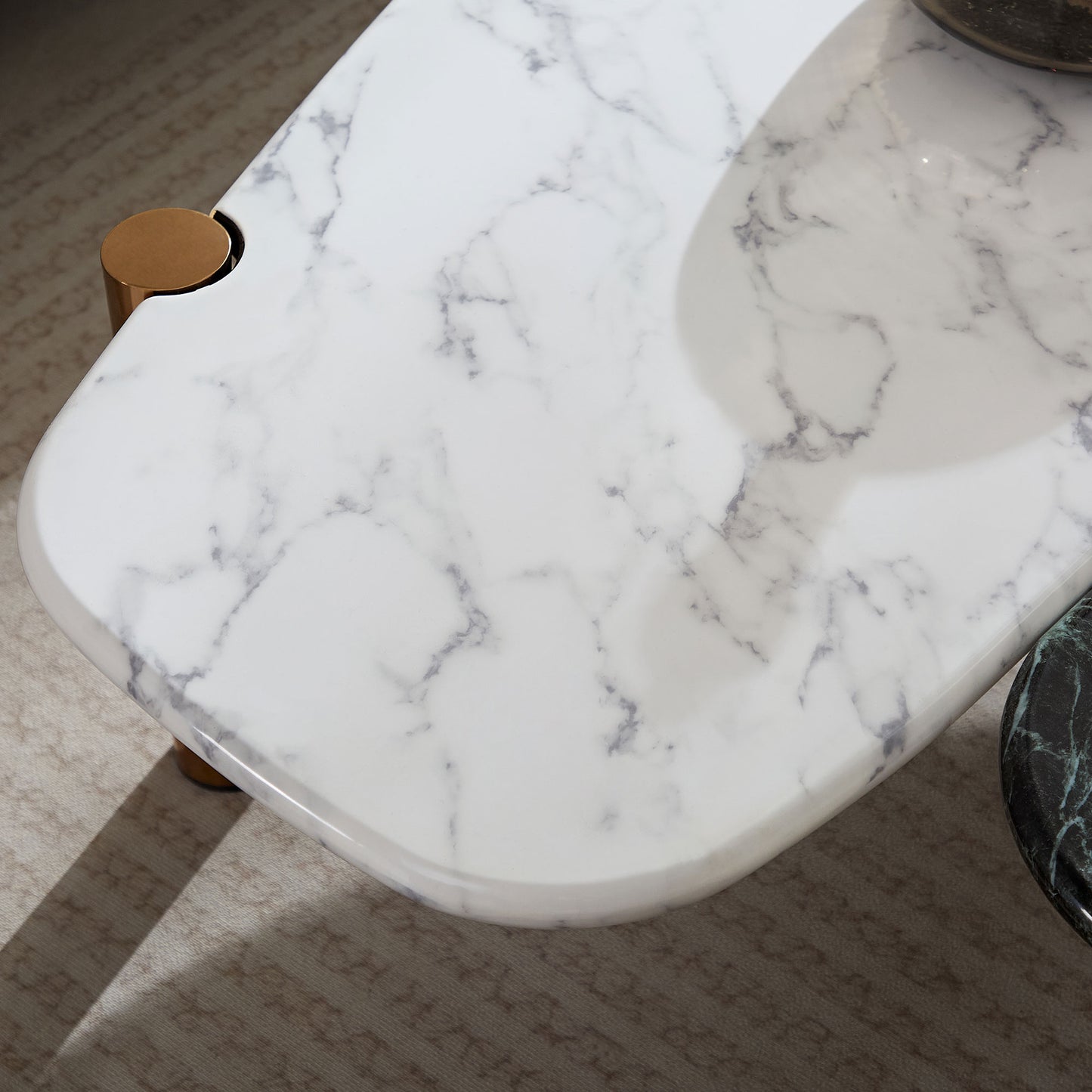 White marble coffee table with brushed gold accent