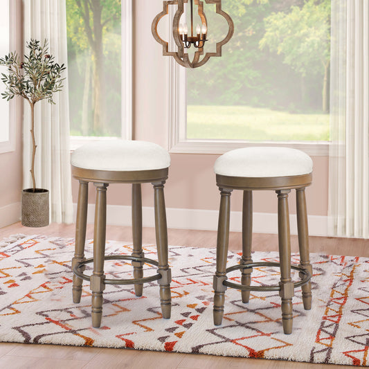 Two cream upholstered wooden bar stools with dark metal footrests