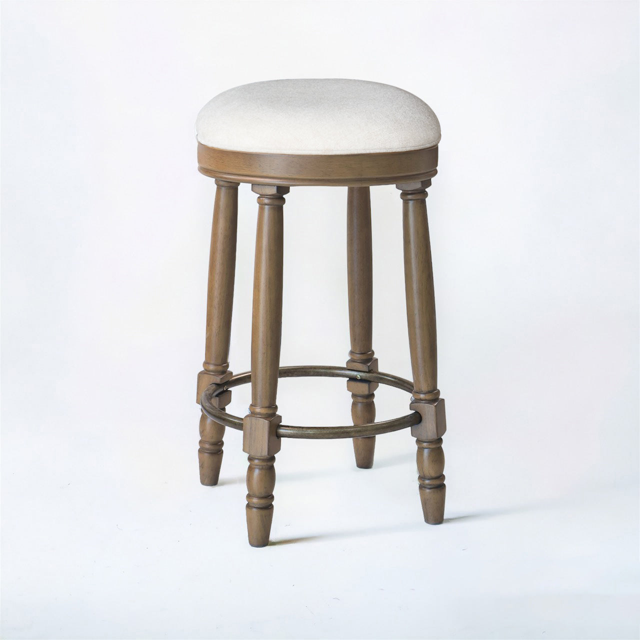 Round upholstered bar stool with wooden legs and metal footrest