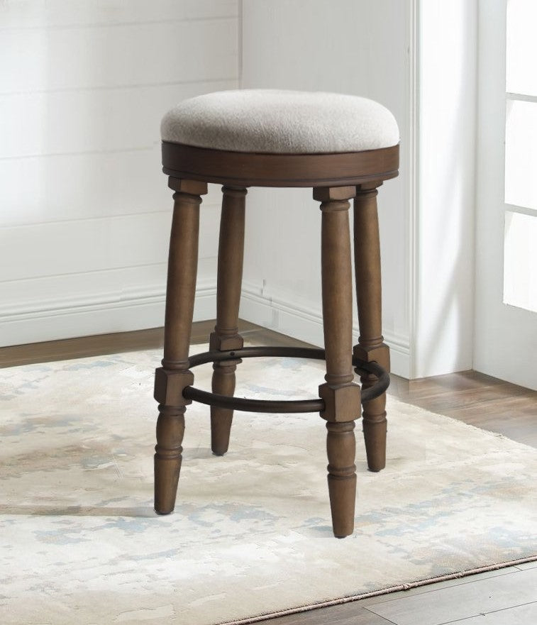 Wooden swivel bar stool with beige upholstered seat