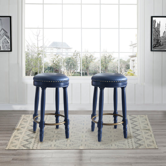 Navy blue upholstered bar stools with brass footrests