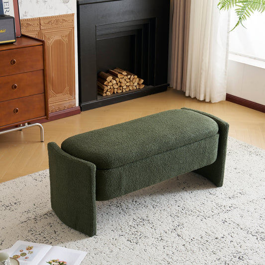 Plush green storage bench with curved arms and modern design