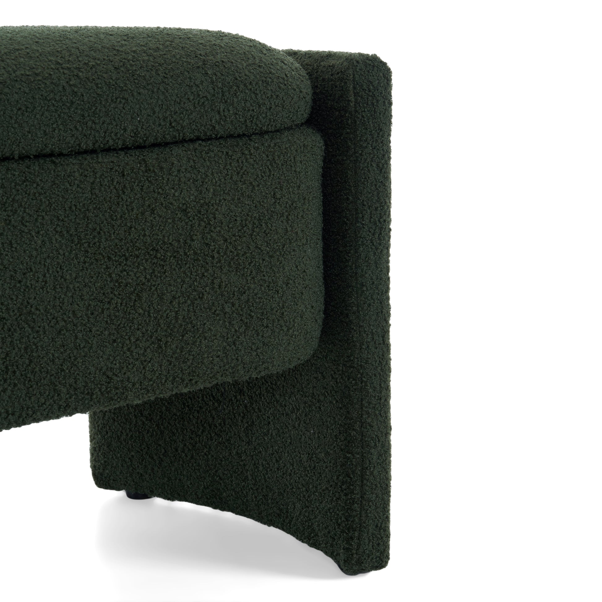 Textured dark green boucle ottoman with curved edge