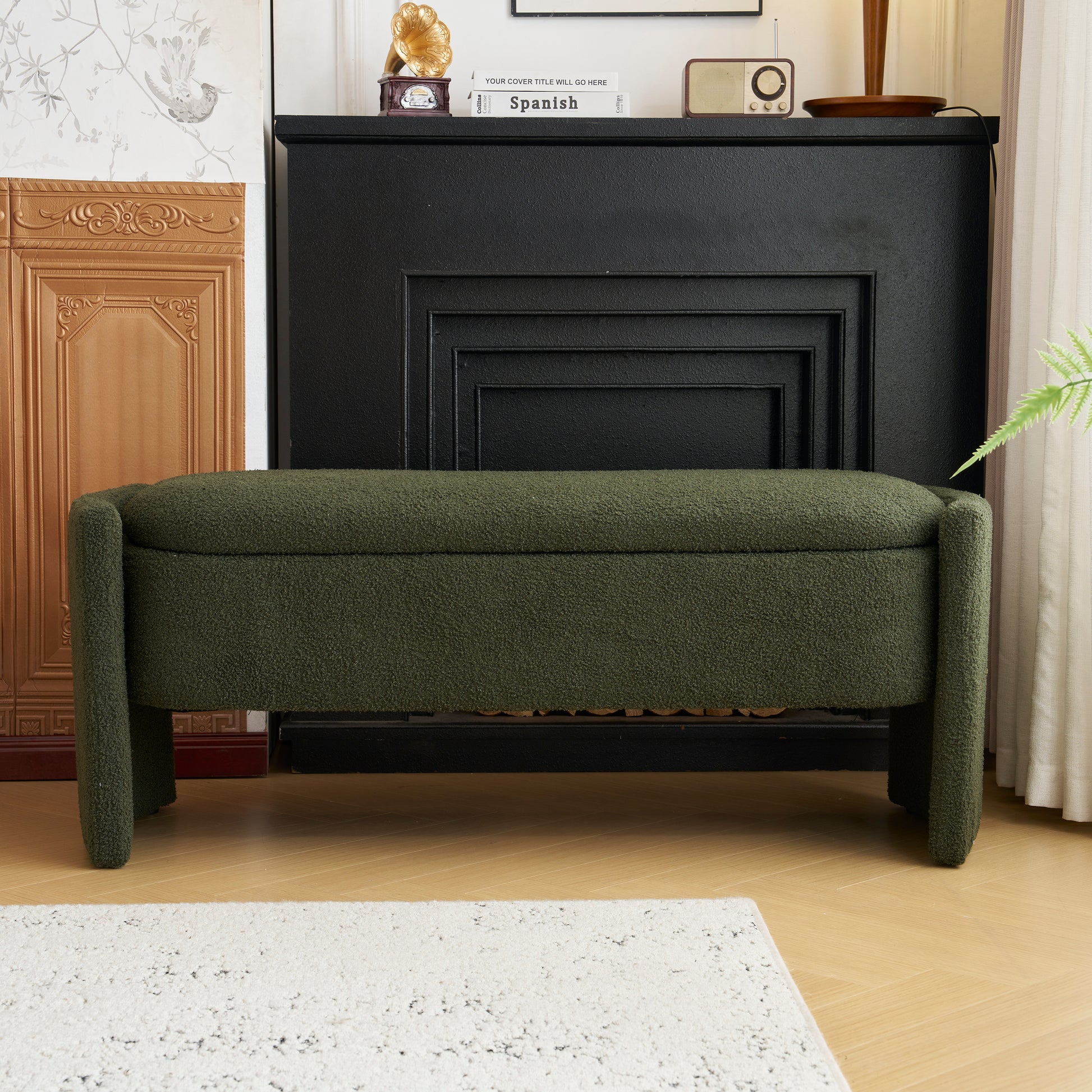 Green boucle storage bench with black fireplace
