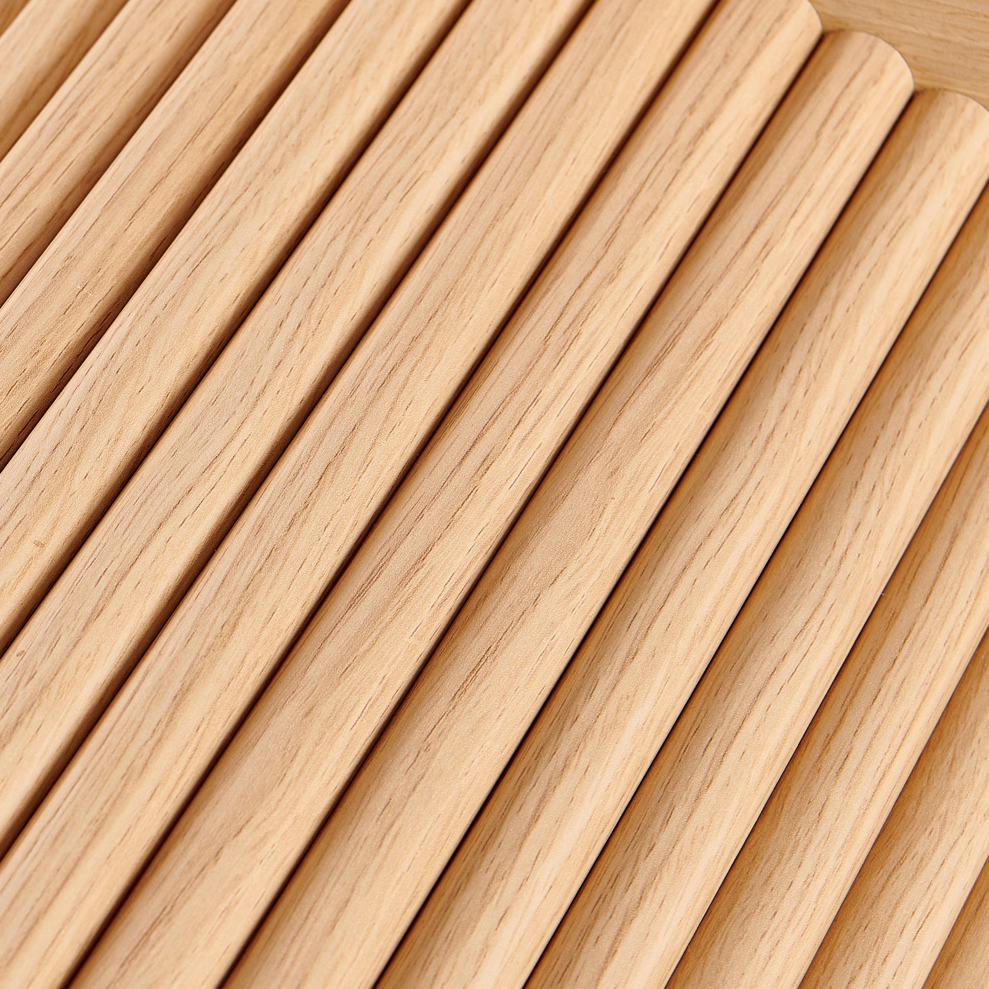 Natural oak wood dowels arranged diagonally
