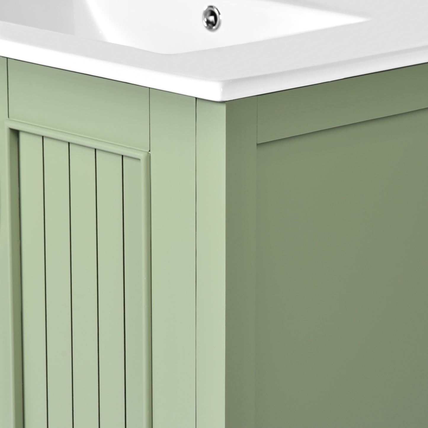 Sage green wood vanity cabinet with beaded panel detail