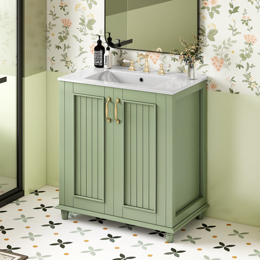 Sage green wood vanity with gold hardware