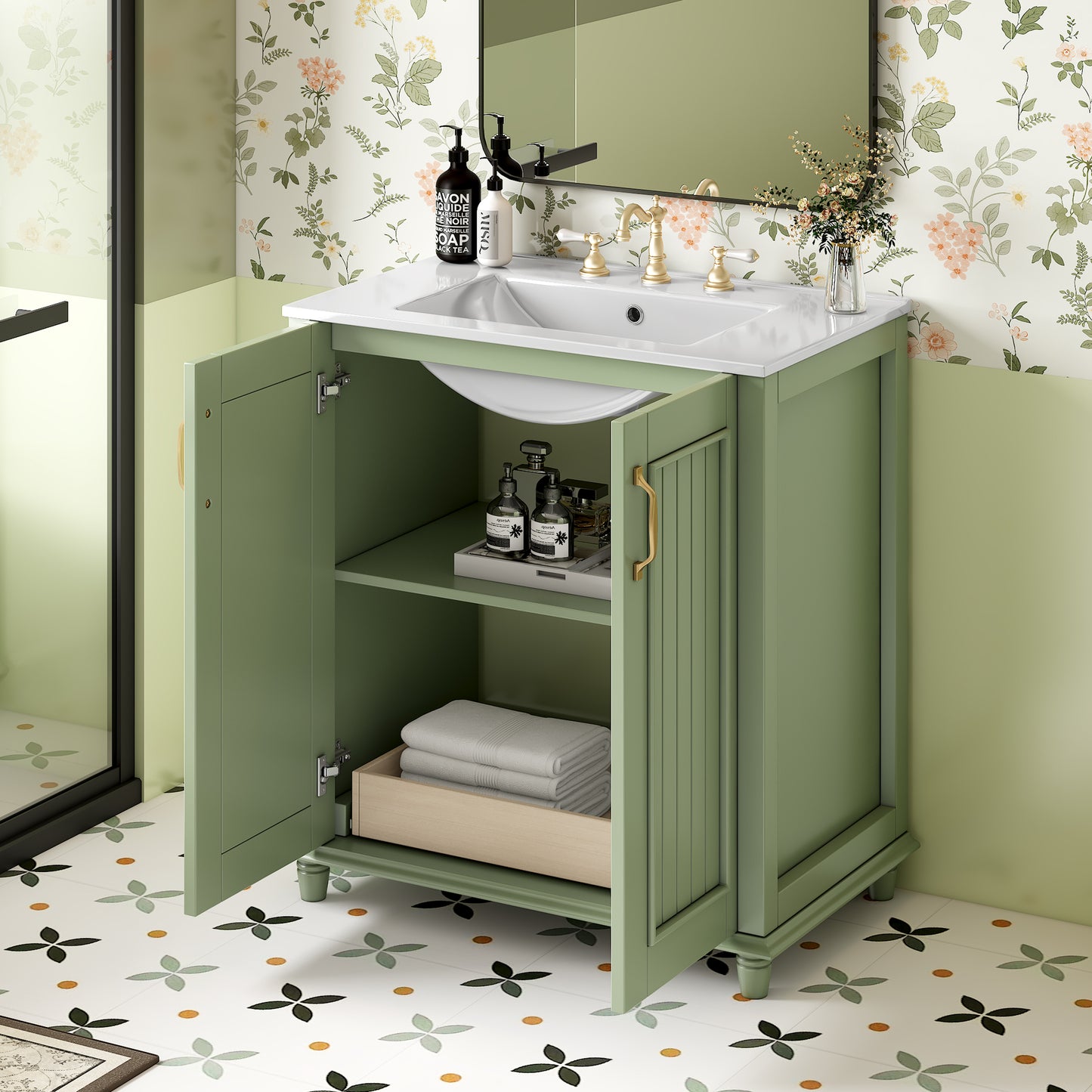 Green bathroom vanity with white sink and gold faucet