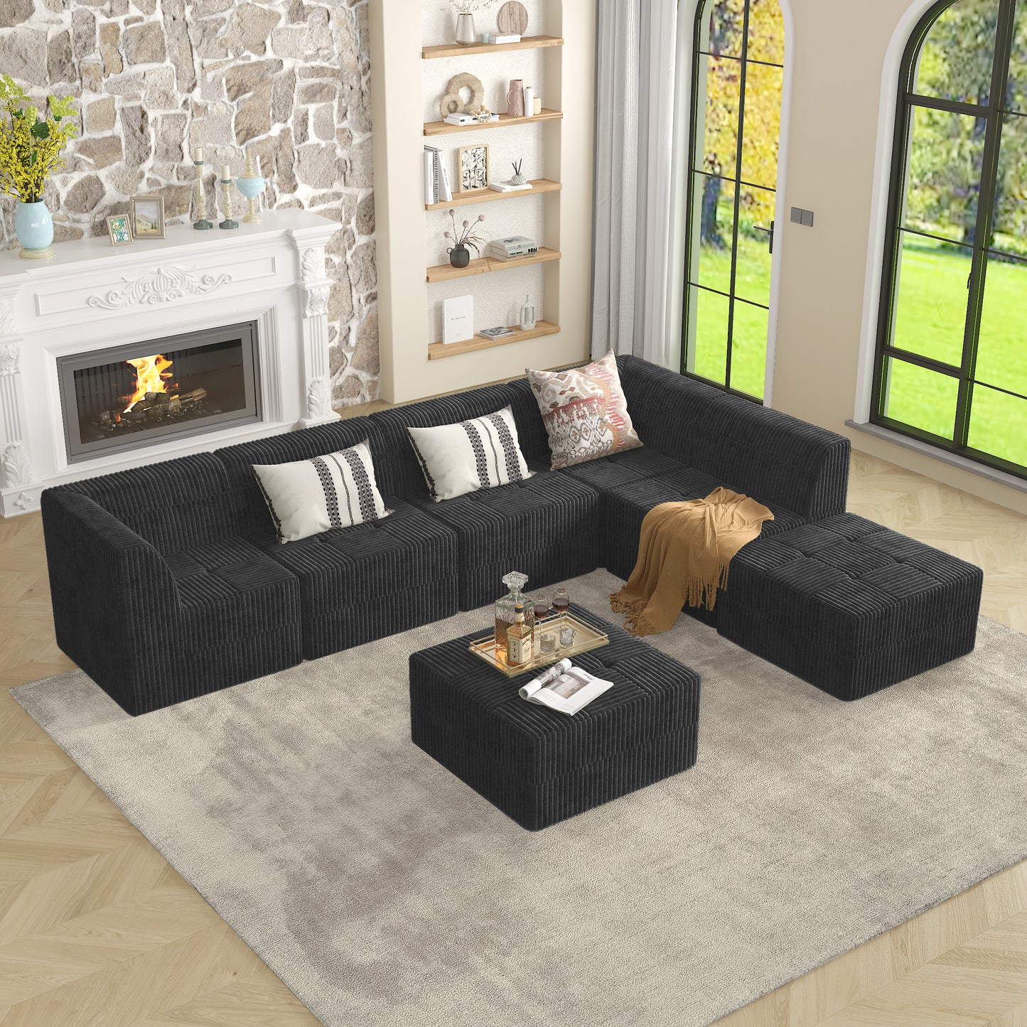 Dark gray corduroy sectional sofa with plush texture and matching ottomans