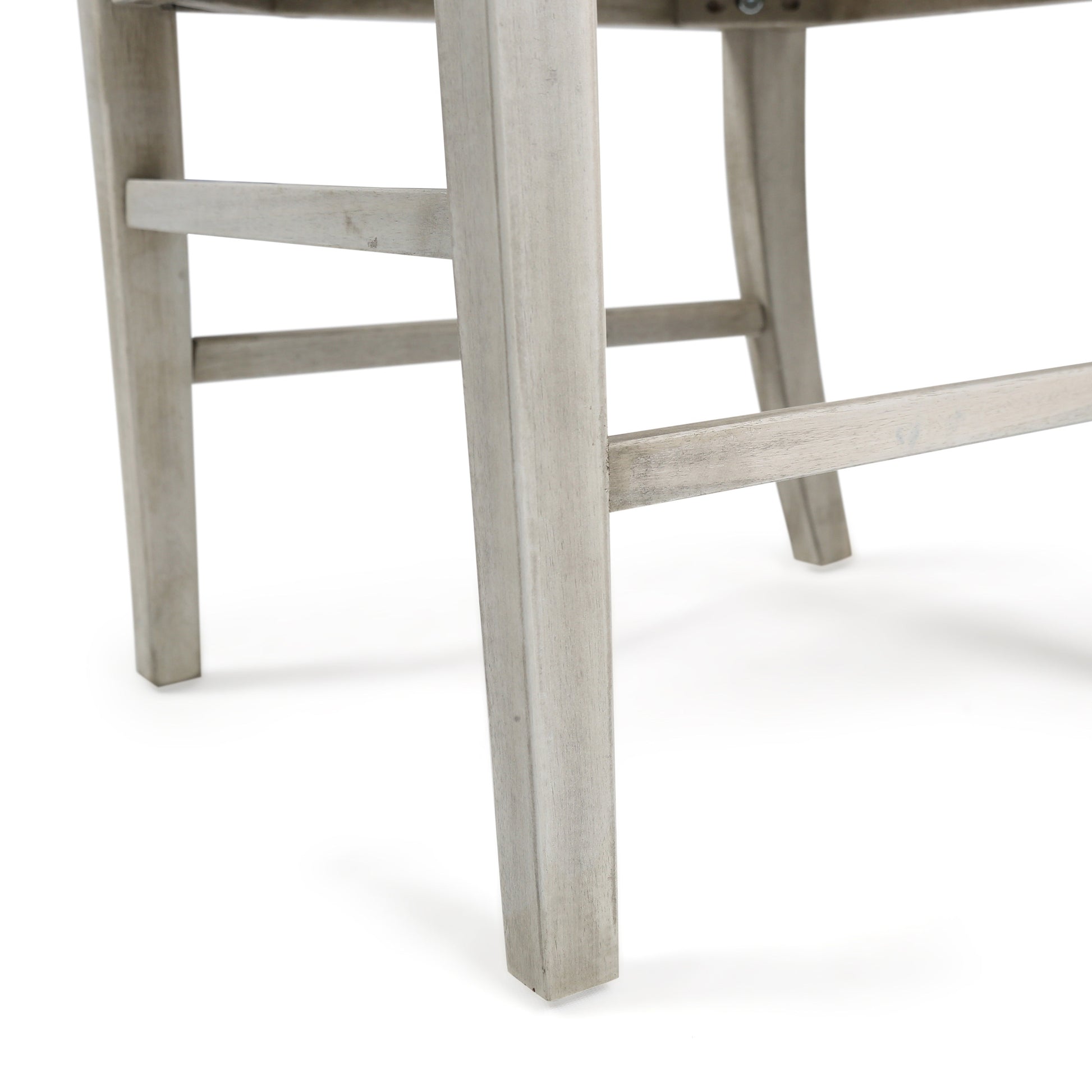 Closeup of weathered gray wood bar stool legs on white background