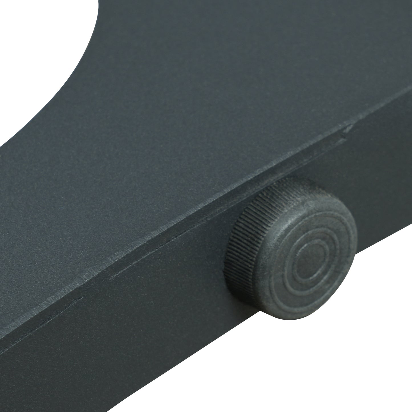 Dark gray adjustable knob on textured metal tripod leg