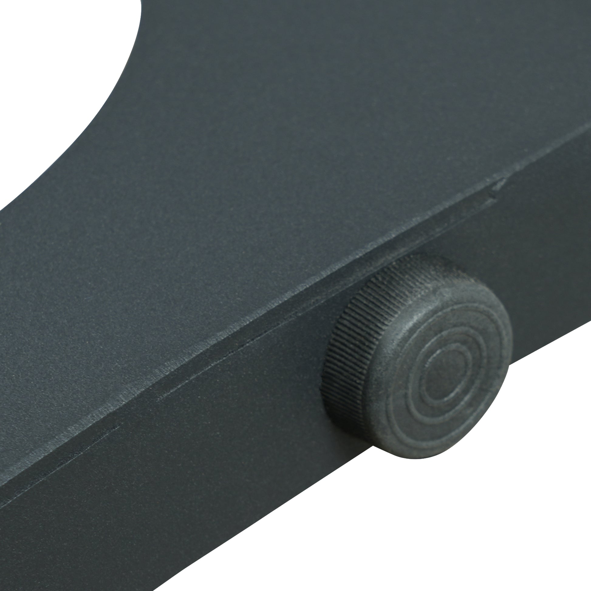 Dark gray adjustable knob on textured metal tripod leg