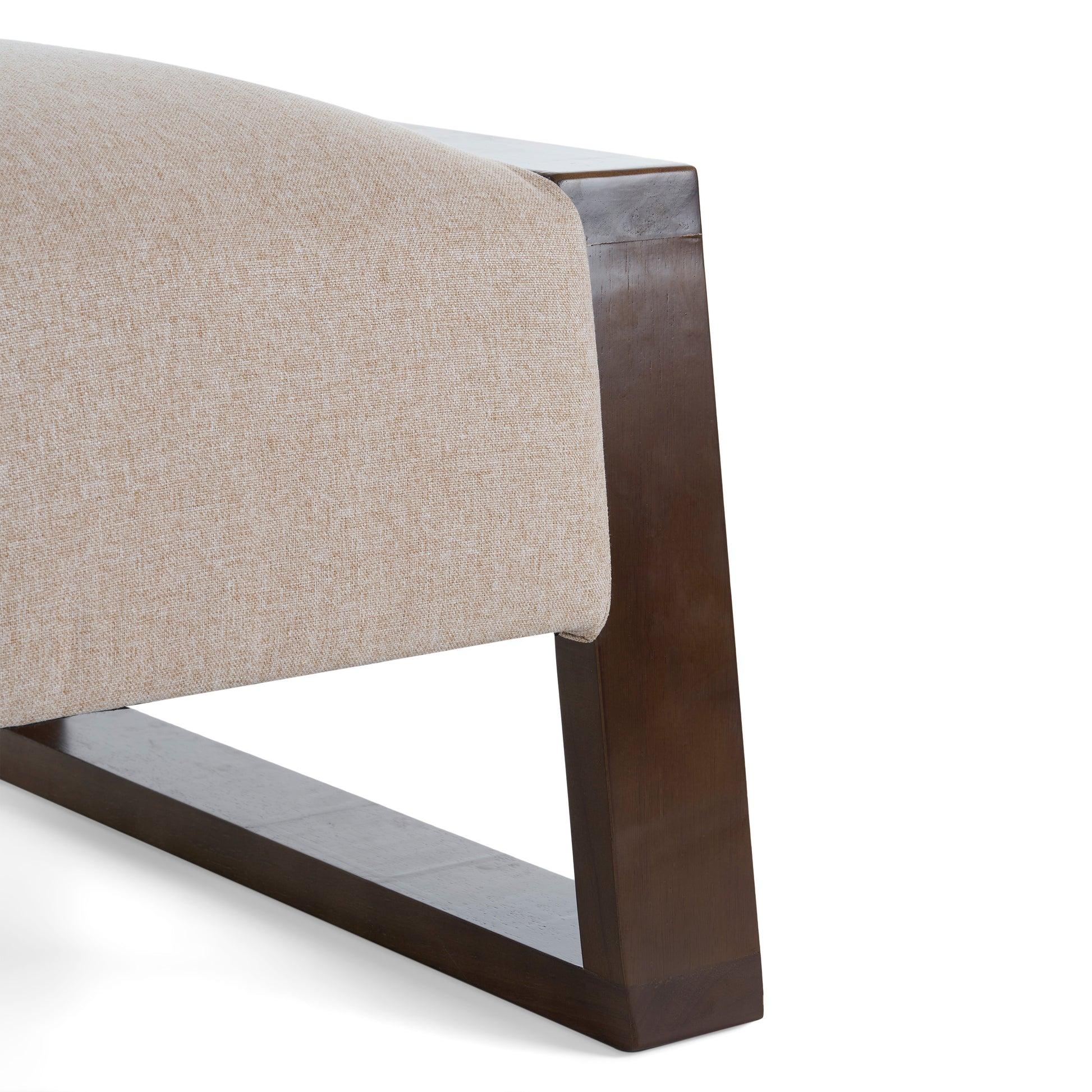 Beige upholstered chair armrest with dark wood frame accent