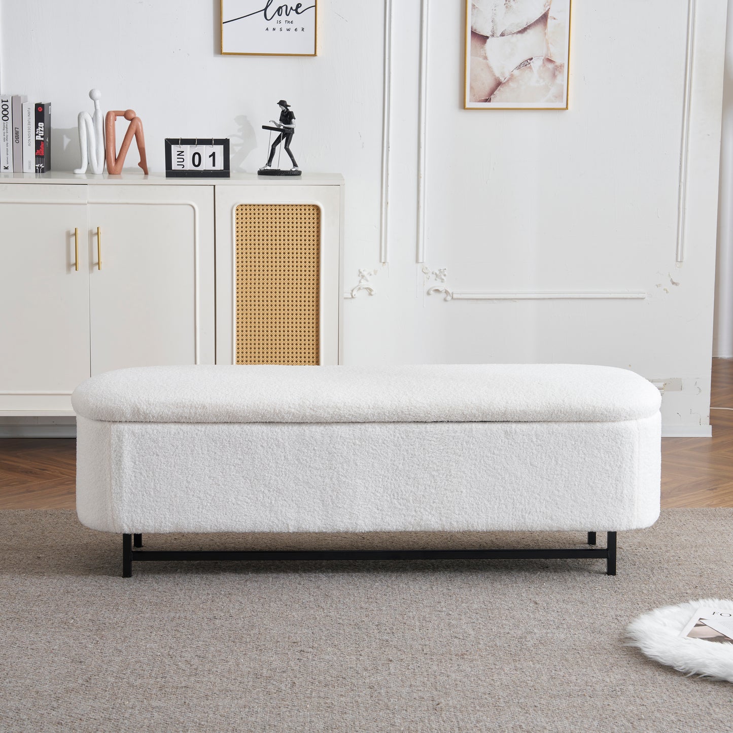 White boucle storage ottoman with black metal legs