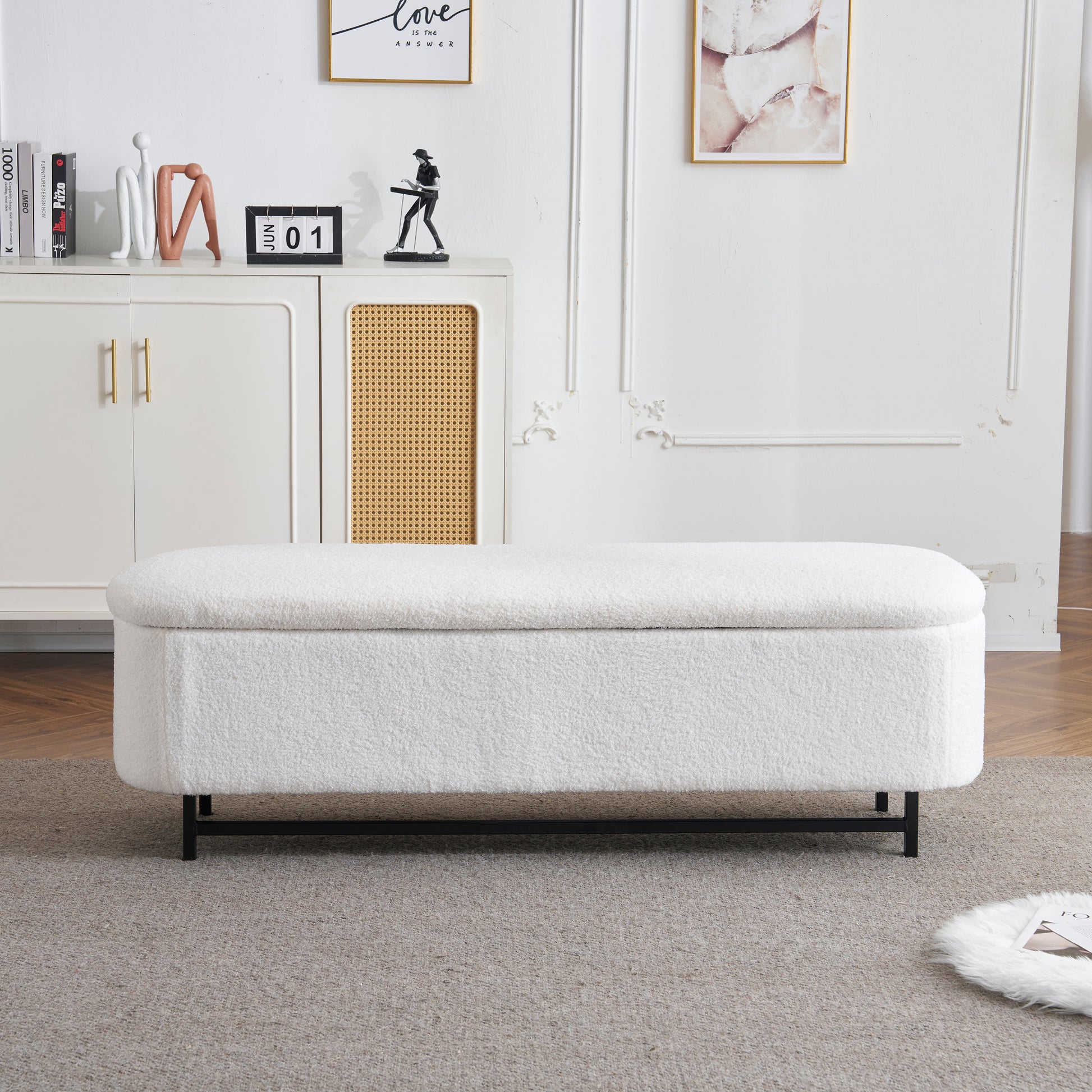 White boucle storage ottoman with black metal legs