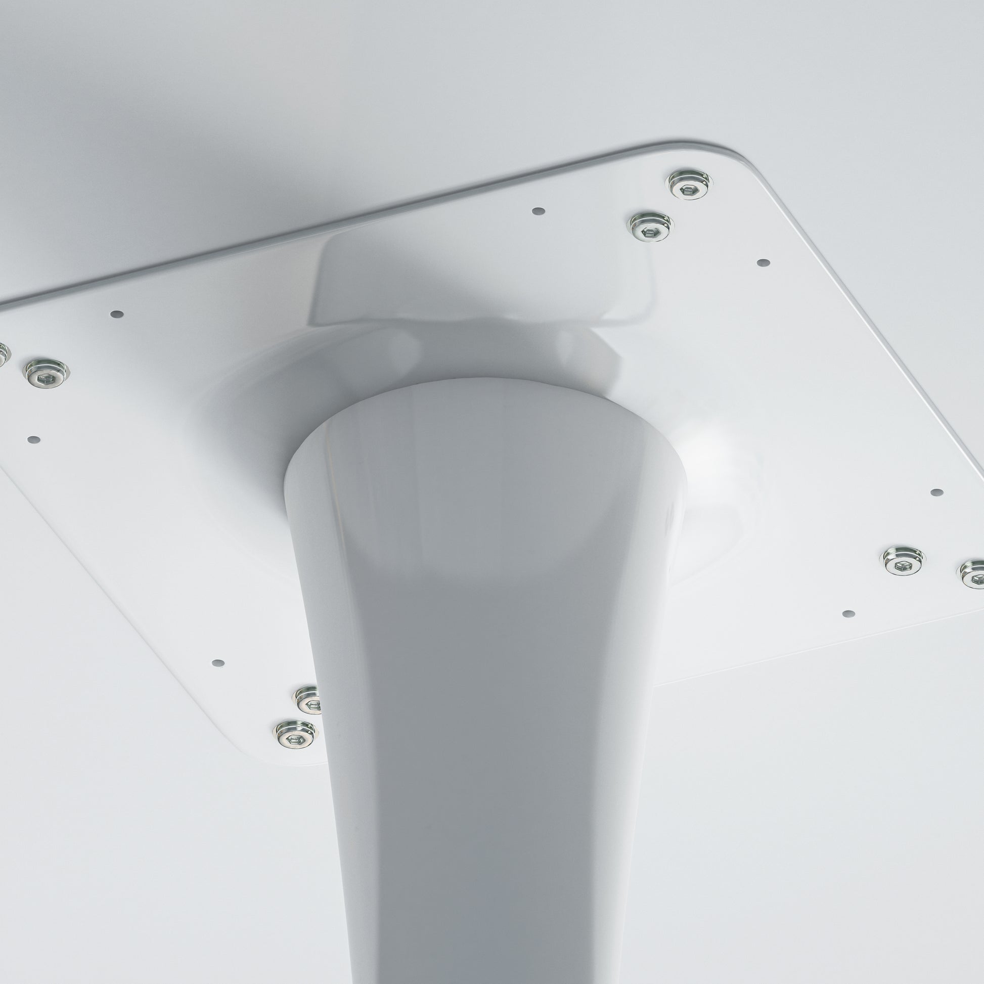 White metal table base with central support column and mounting plate