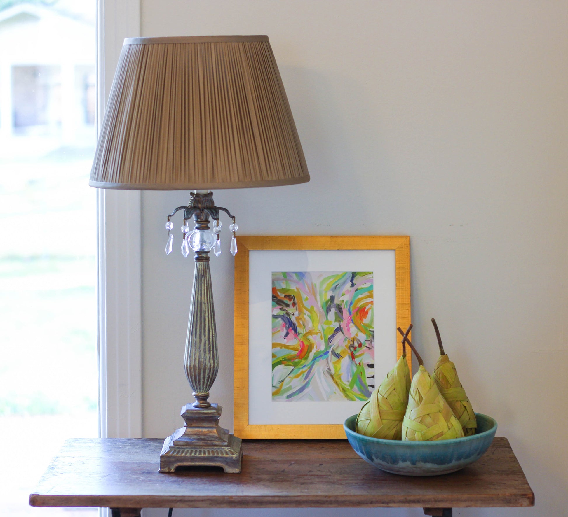 Antique brass table lamp with pleated taupe shade and crystal accents