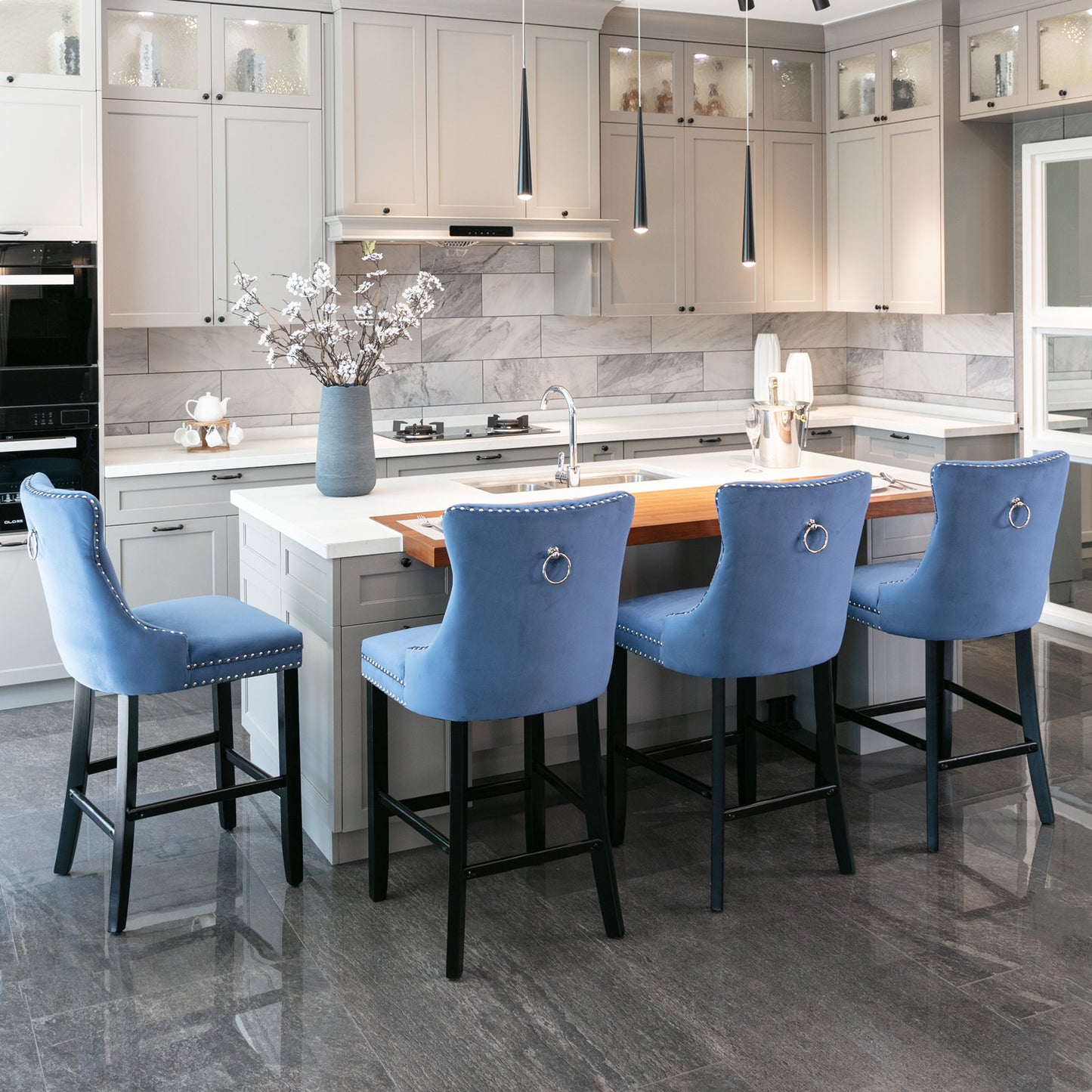 Blue velvet counter stool with silver nailhead trim and ring pull