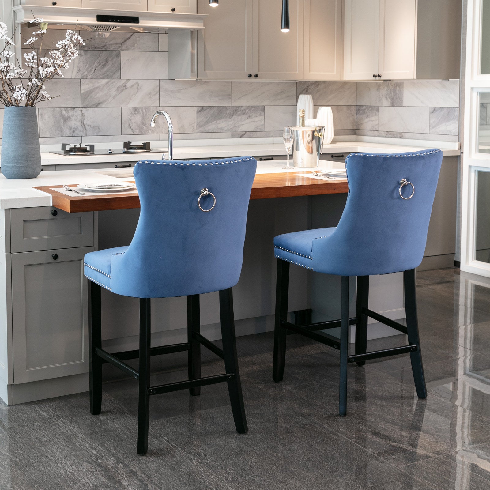 Blue velvet bar stool with silver ring pull and nailhead trim
