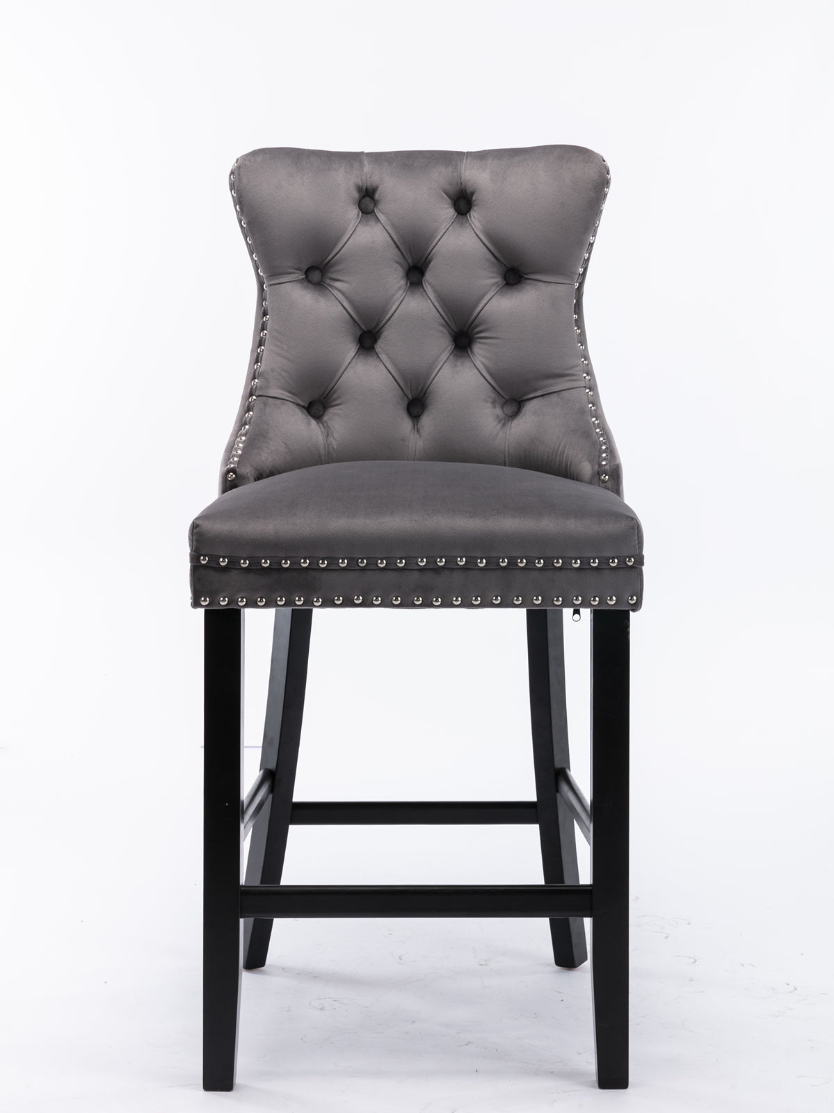 Tufted grey velvet bar stool with silver nailhead trim and dark wood legs