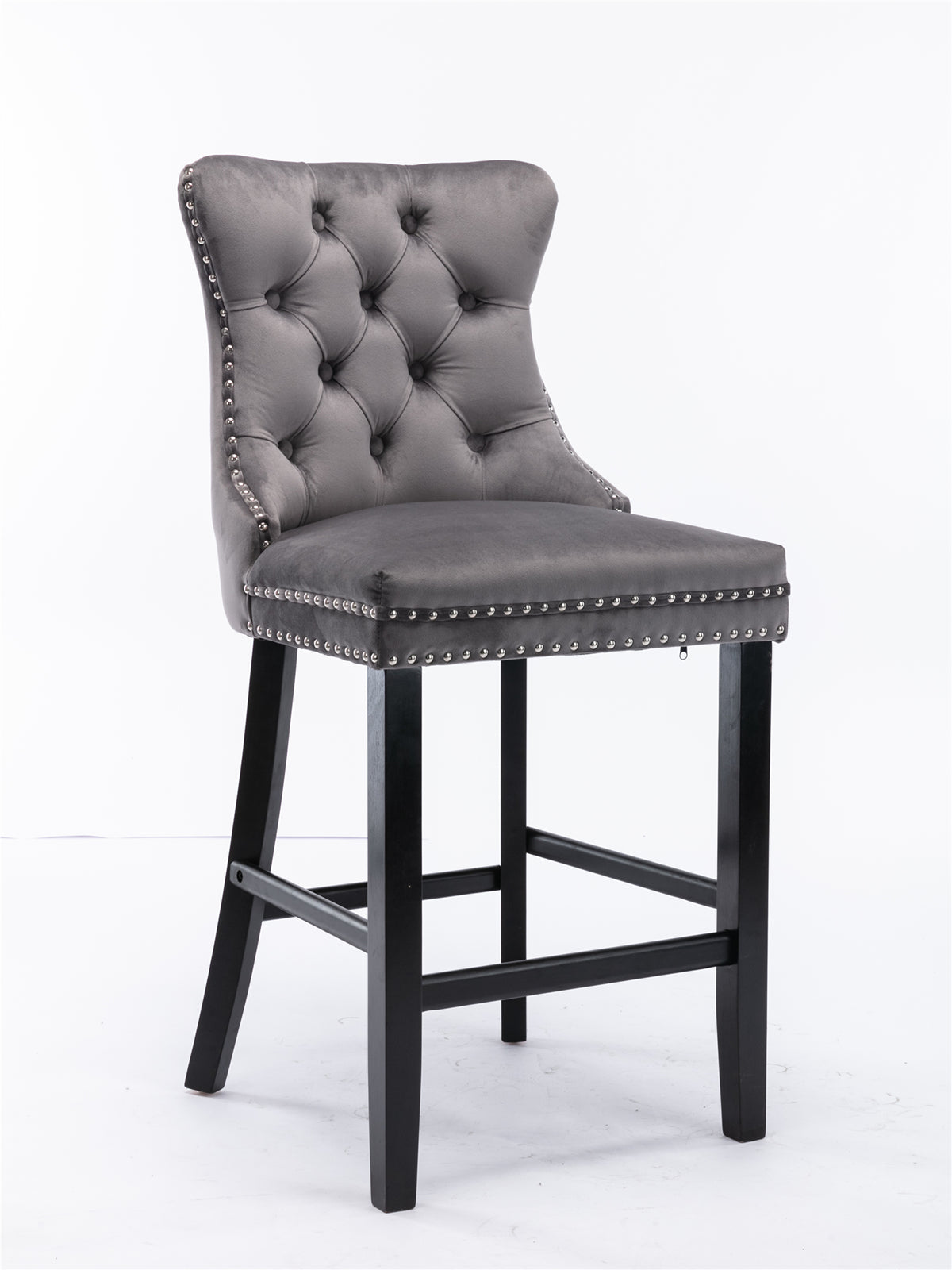 Gray velvet bar stool with tufted back and silver nailhead trim