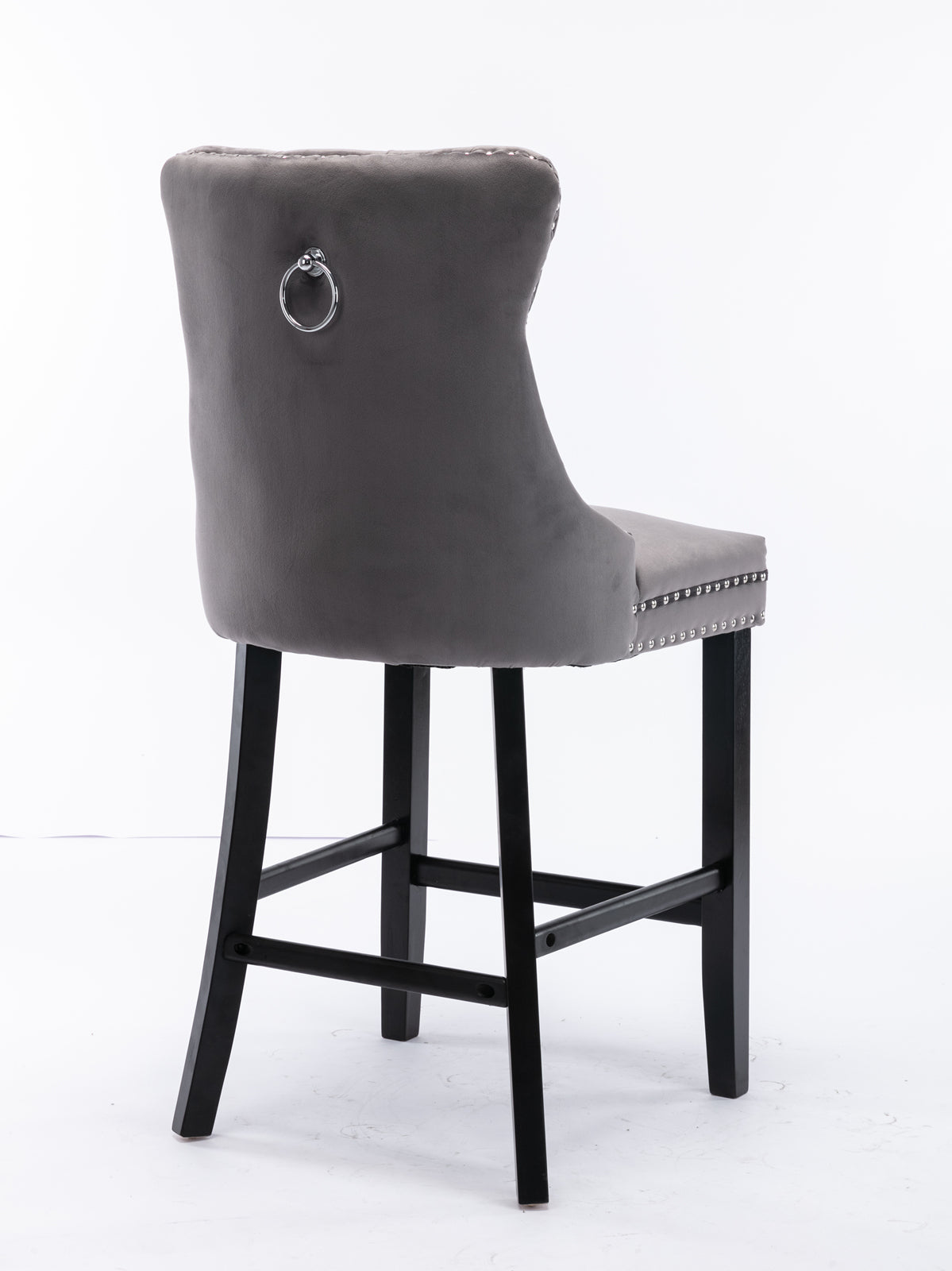 Grey velvet bar stool with decorative nailhead trim and silver ring pull