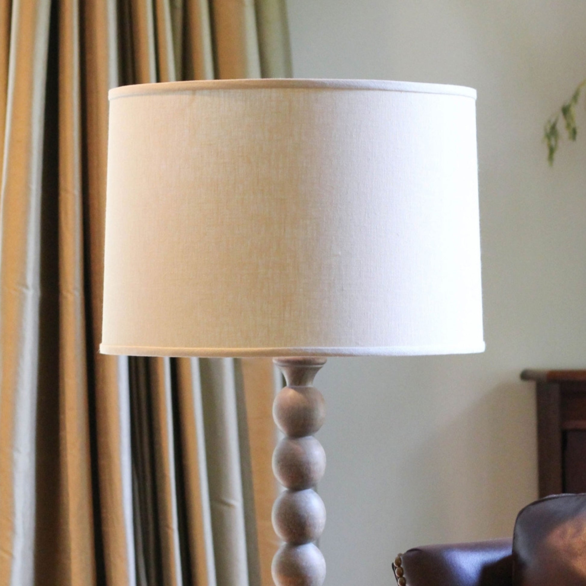 Cream drum lampshade with wooden beaded base
