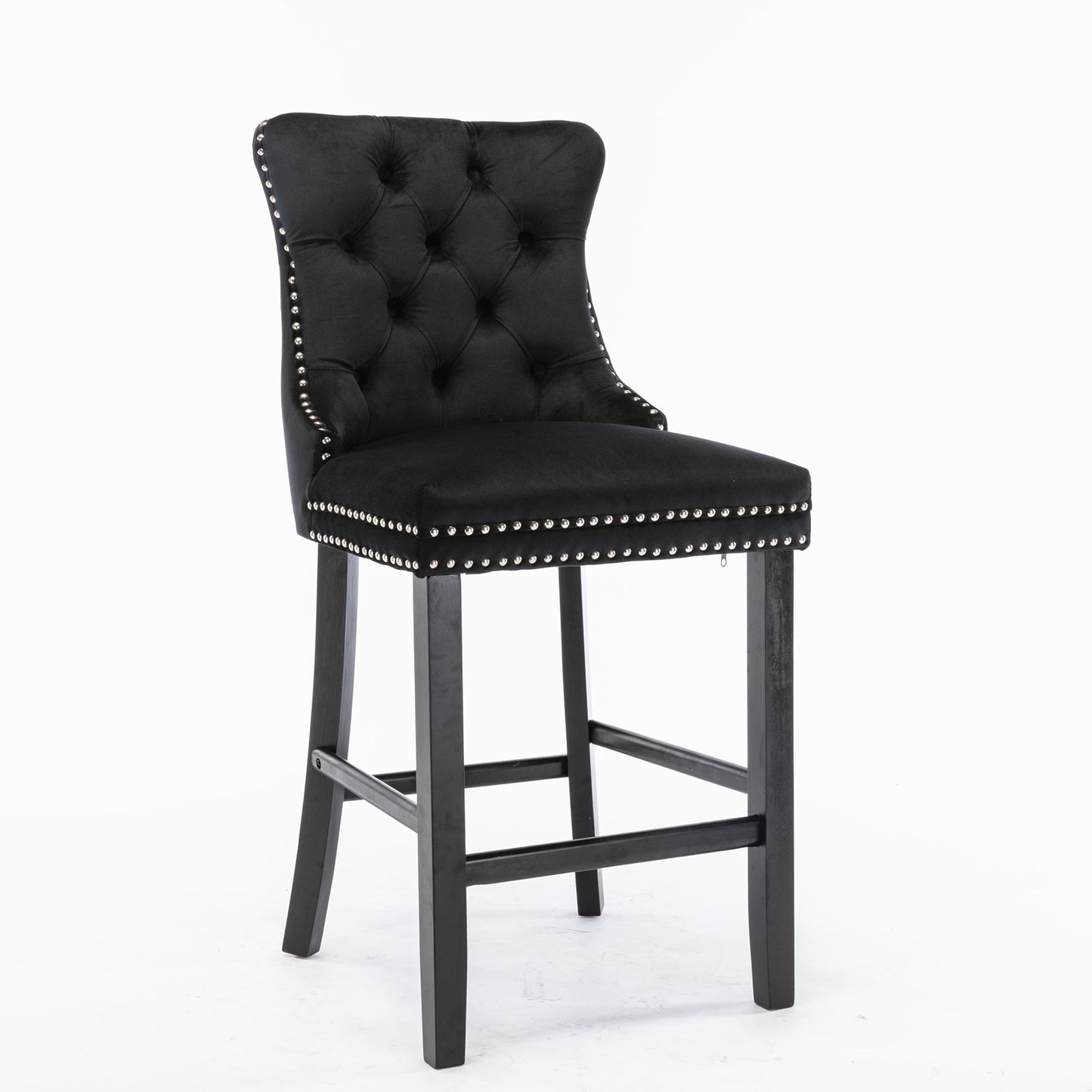 Black velvet tufted bar stool with silver nailhead trim and dark wood legs