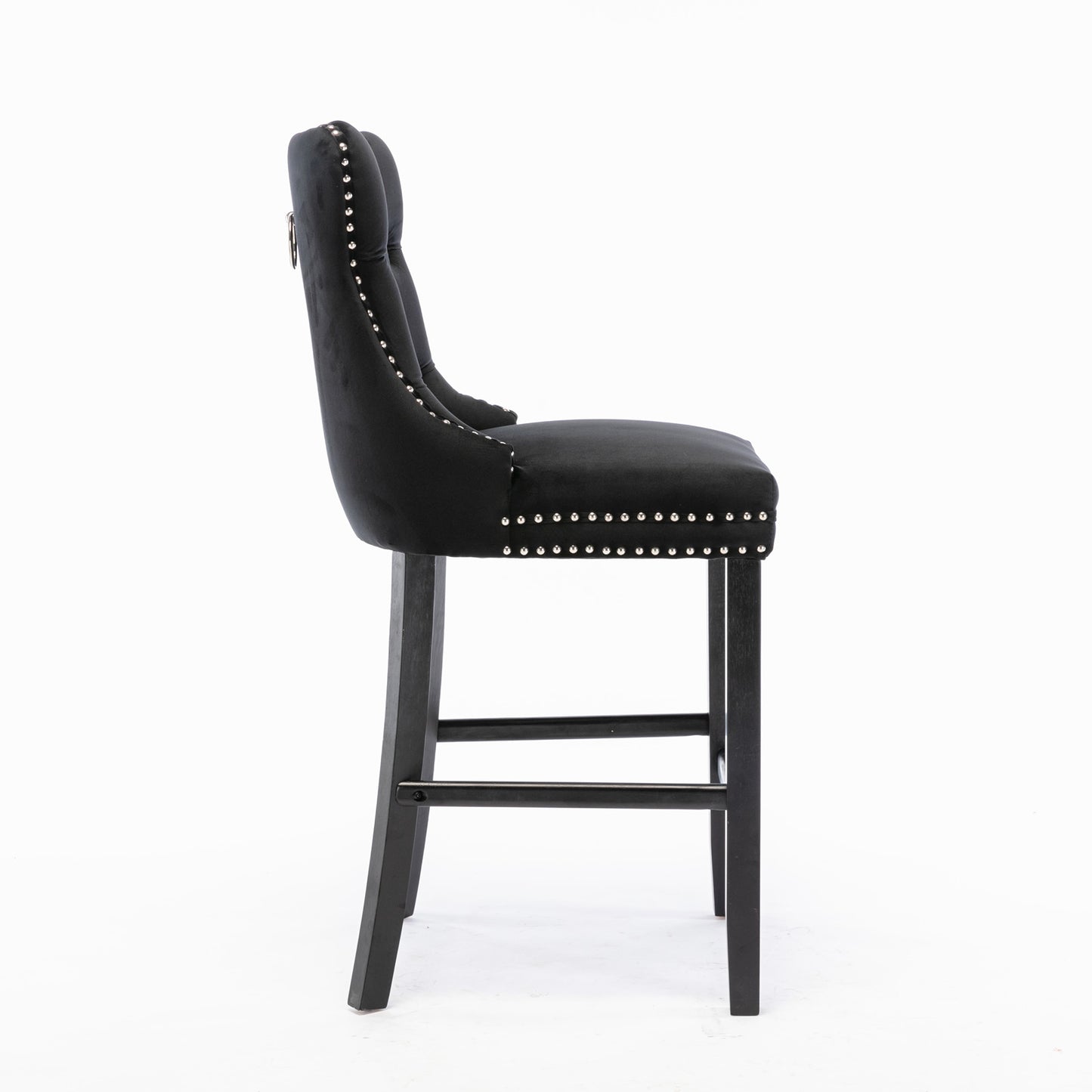 Black velvet tufted bar stool with silver nailhead trim and dark wood legs