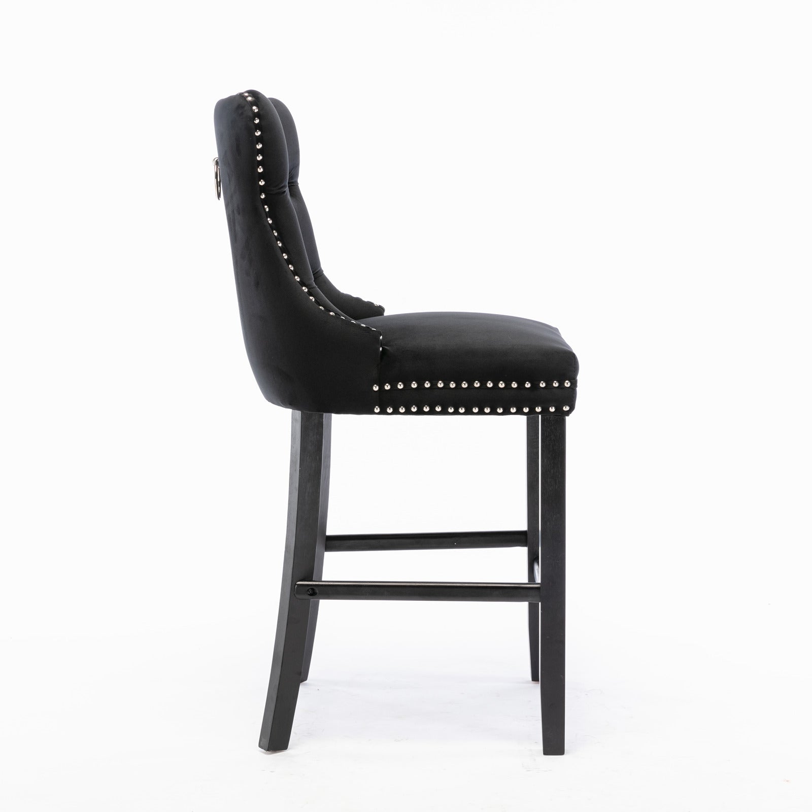 Black velvet tufted bar stool with silver nailhead trim and dark wood legs
