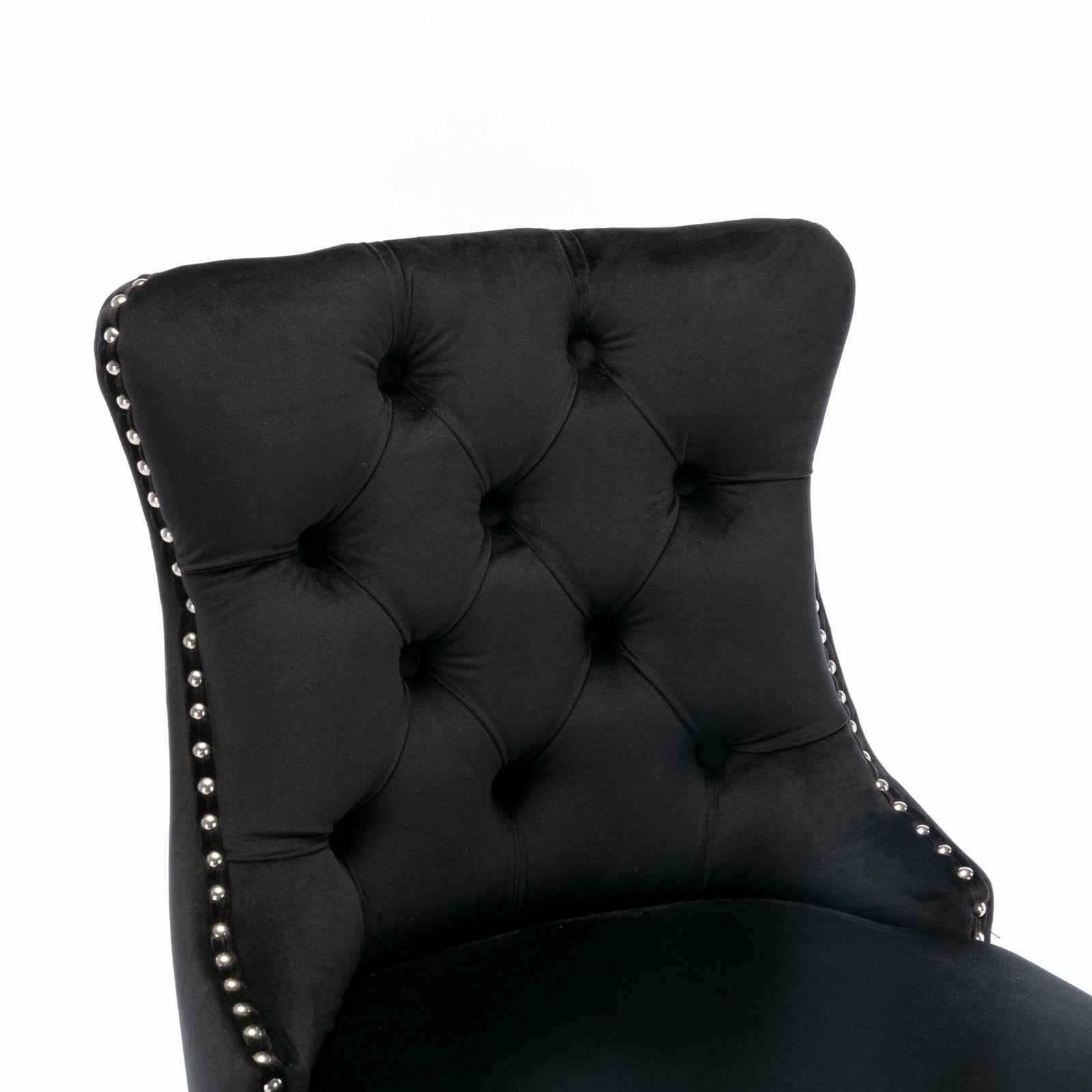 Black velvet tufted accent chair with silver nailhead trim