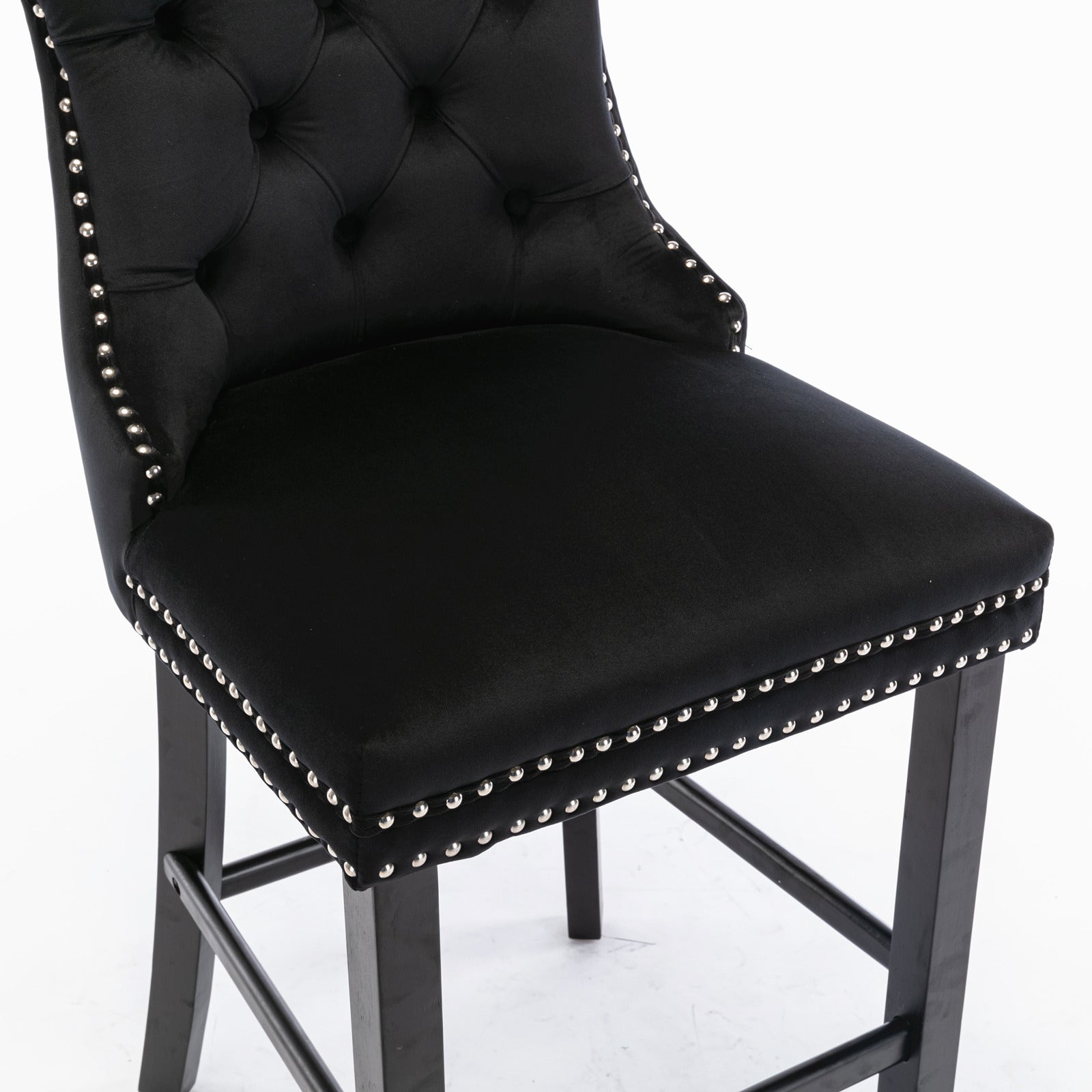 Black velvet bar stool with tufted back and silver nailhead trim