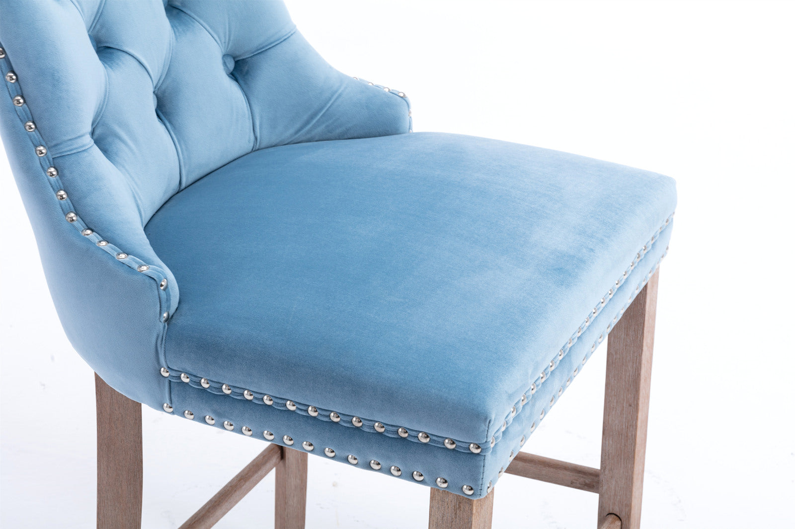 Blue velvet bar stool with tufted back and nailhead trim