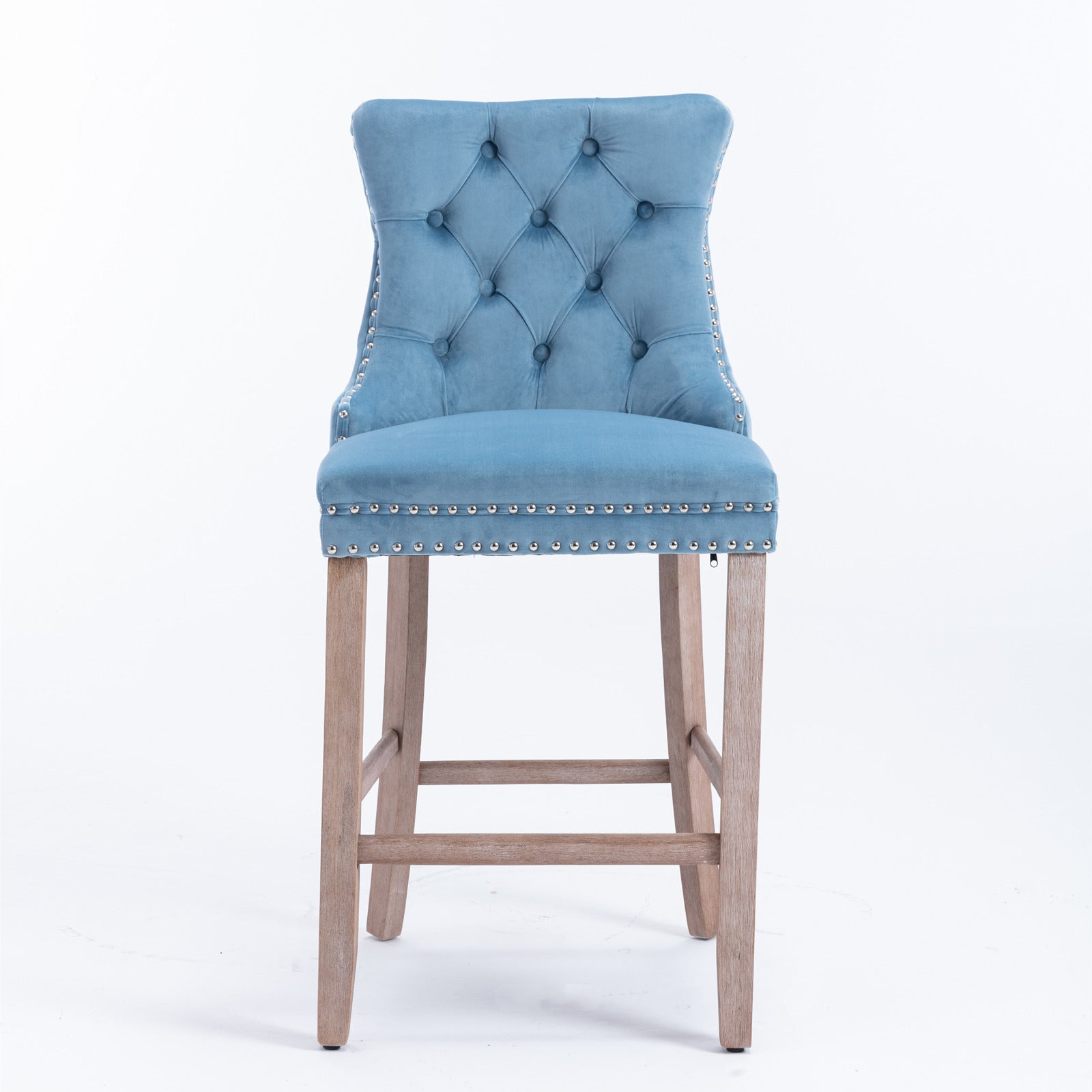 Blue velvet tufted bar stool with silver nailhead trim and wooden legs
