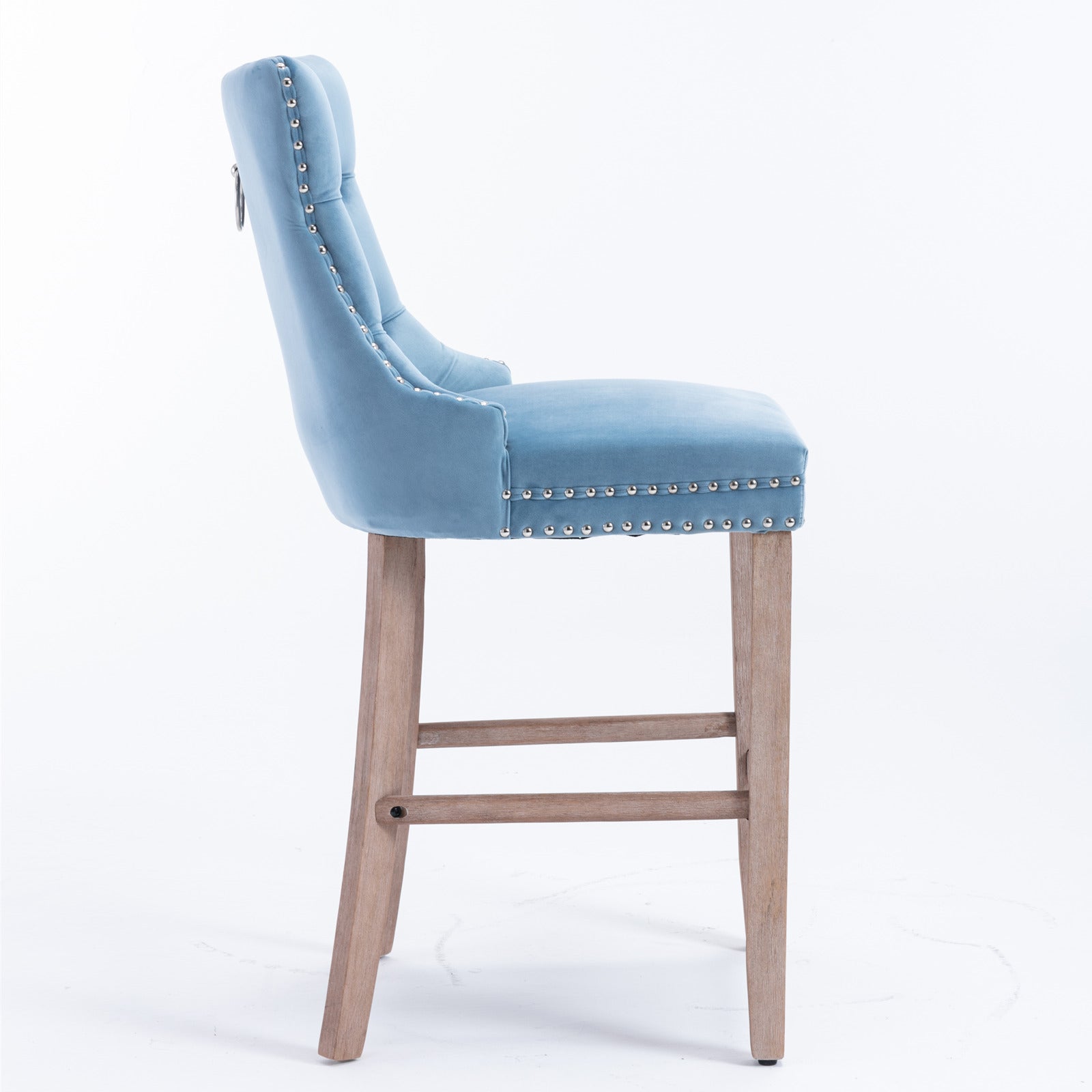 Light blue velvet bar stool with silver nailhead trim and wooden legs