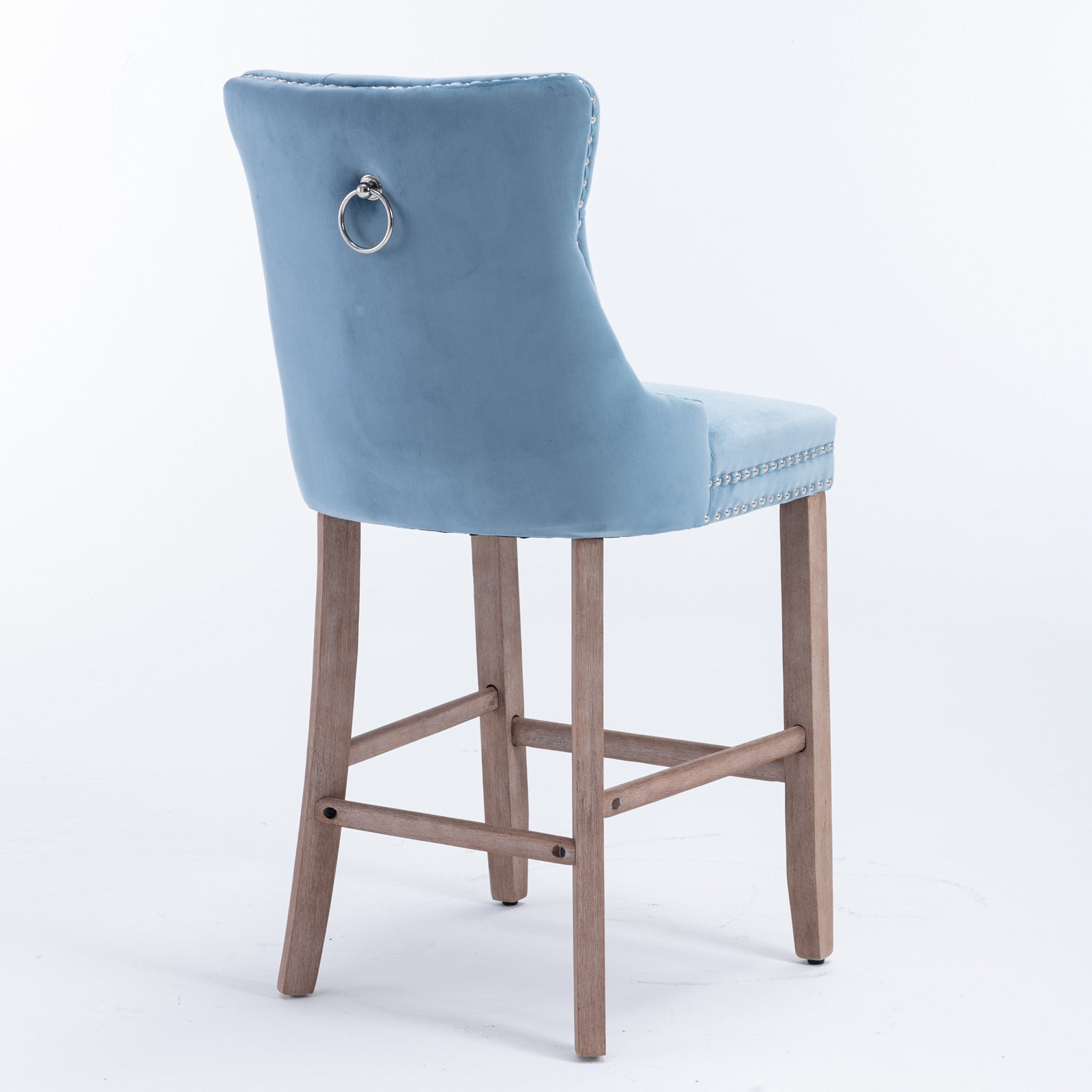 Light blue velvet bar stool with tufted back and silver ring pull