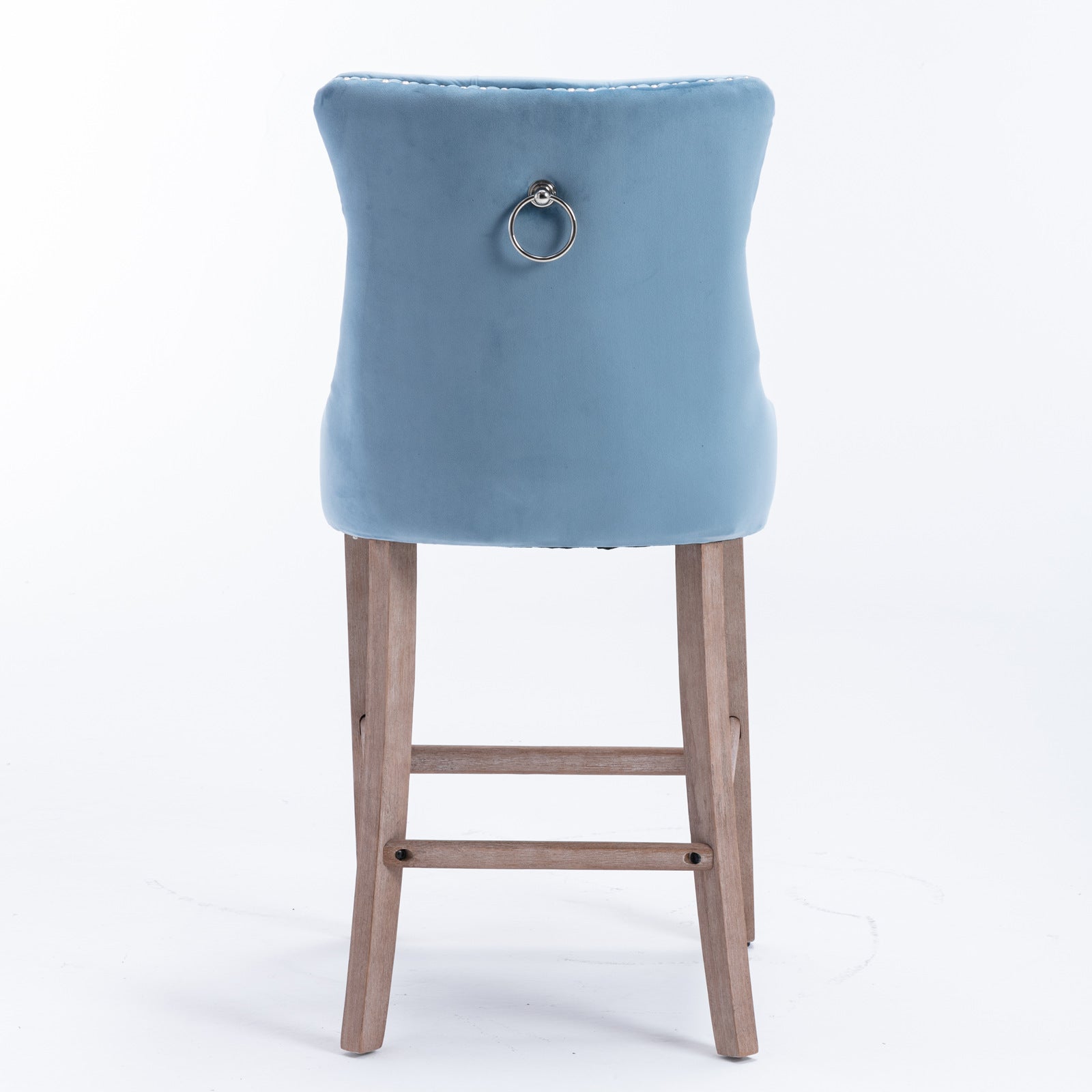 Light blue velvet bar stool with silver ring detail on back and wooden legs