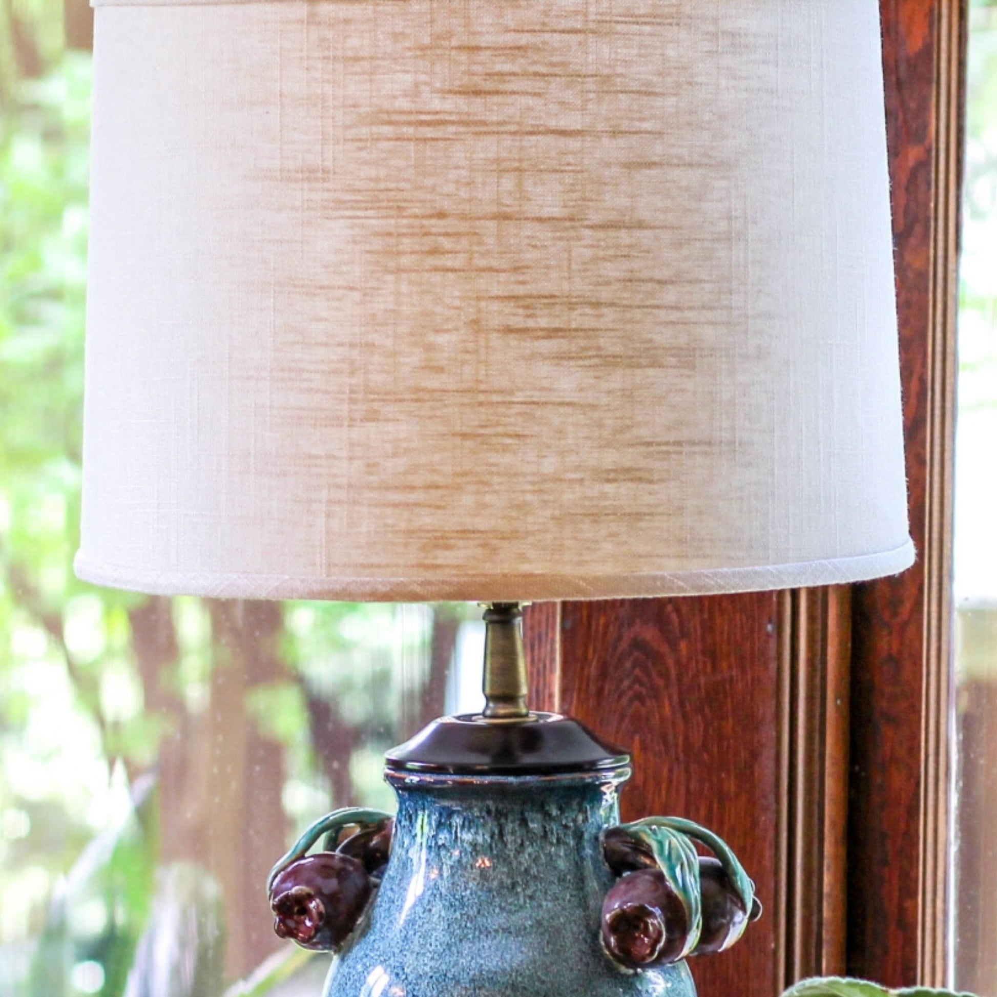 Rustic ceramic table lamp with distressed teal base and linen shade