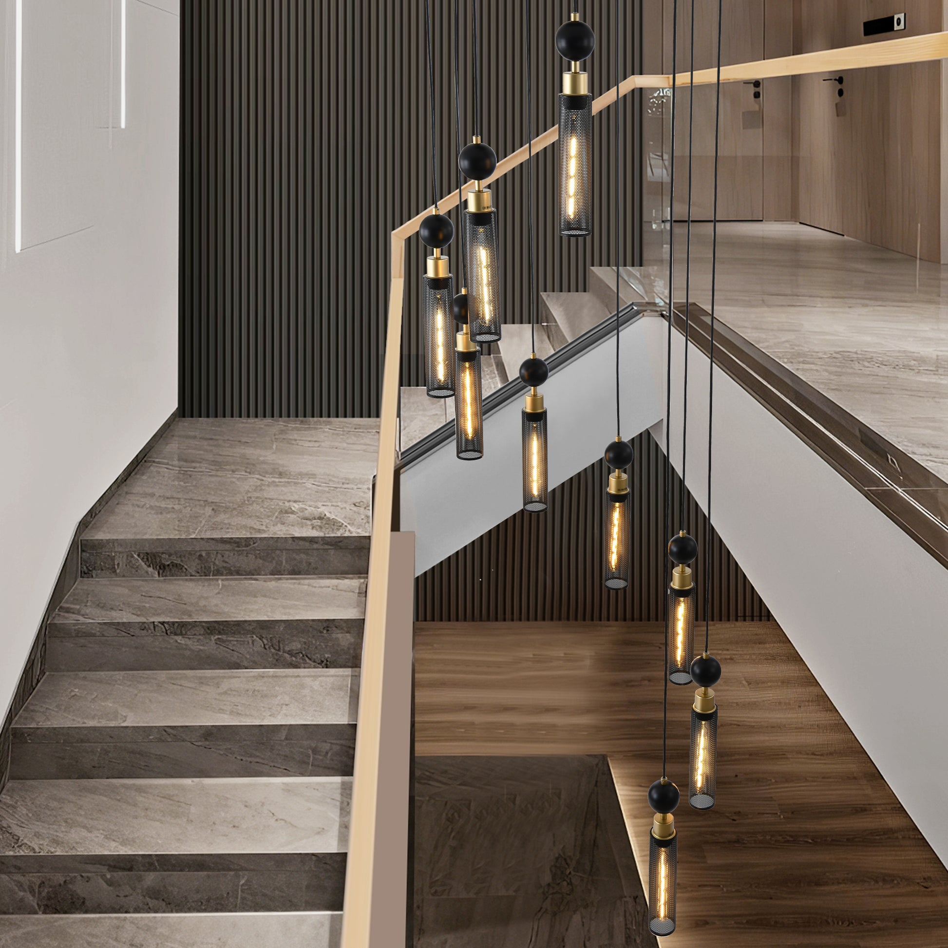 Modern black metal cylinder pendant light with brass accents and a black sphere detail