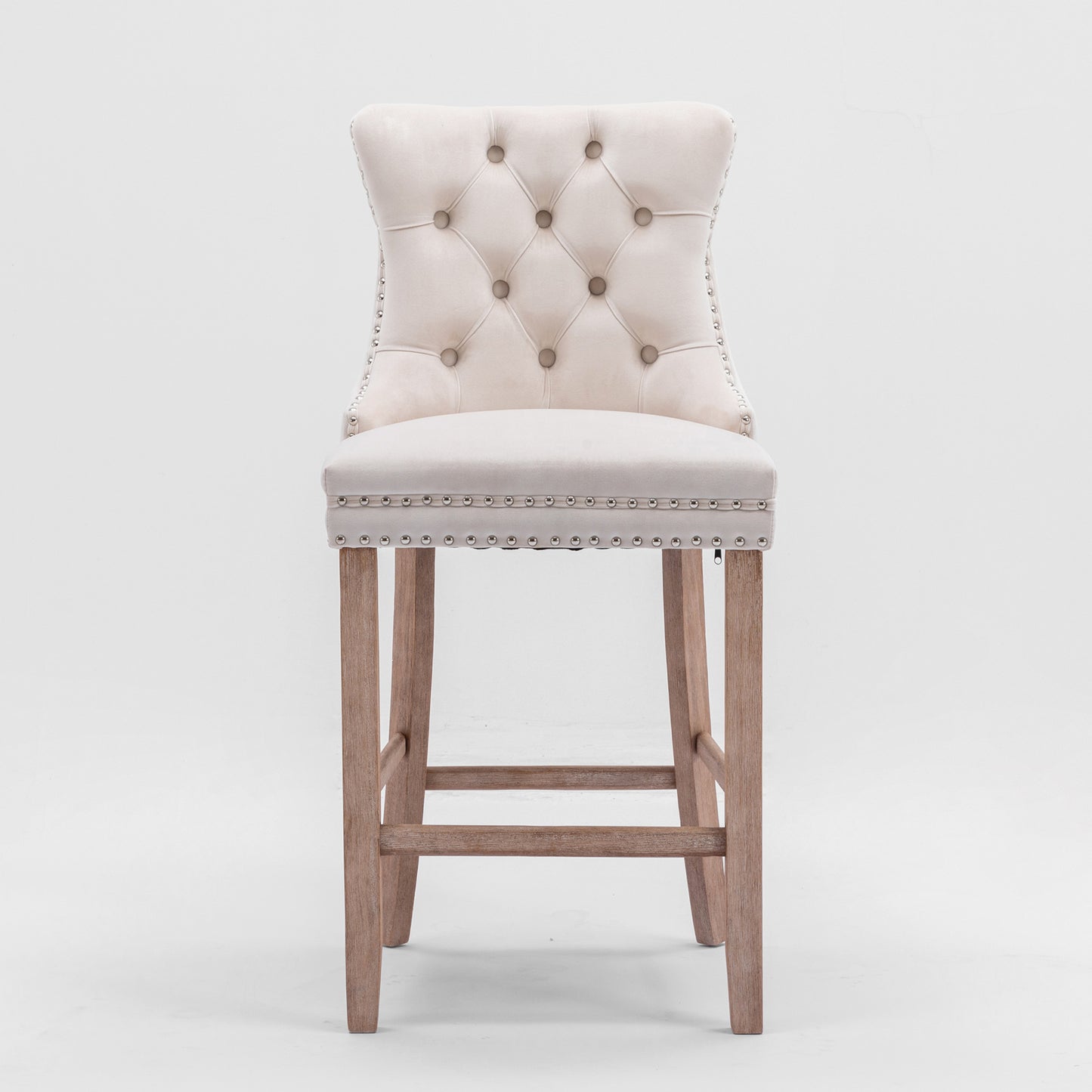 Cream velvet tufted bar stool with silver nailhead trim and wooden legs