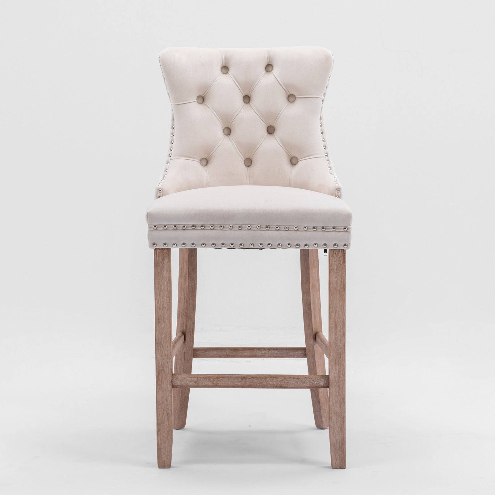 Cream velvet tufted bar stool with silver nailhead trim and wooden legs