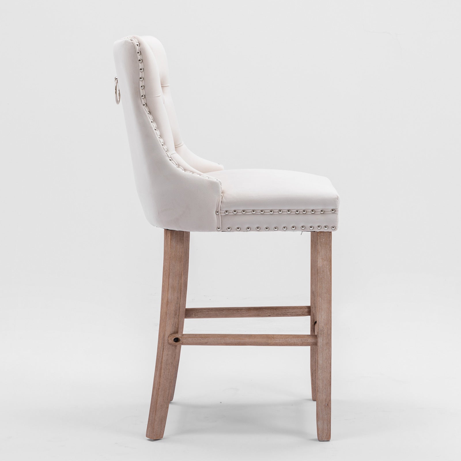 Cream velvet tufted bar stool with silver nailhead trim and wooden legs