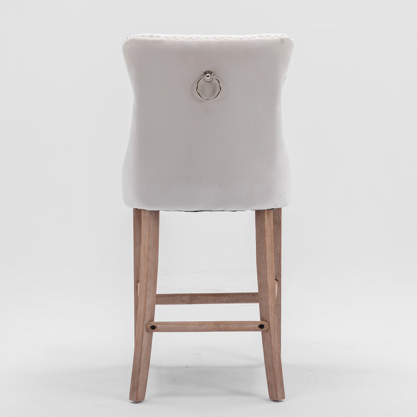 Light gray velvet bar stool with ring pull and tufted back