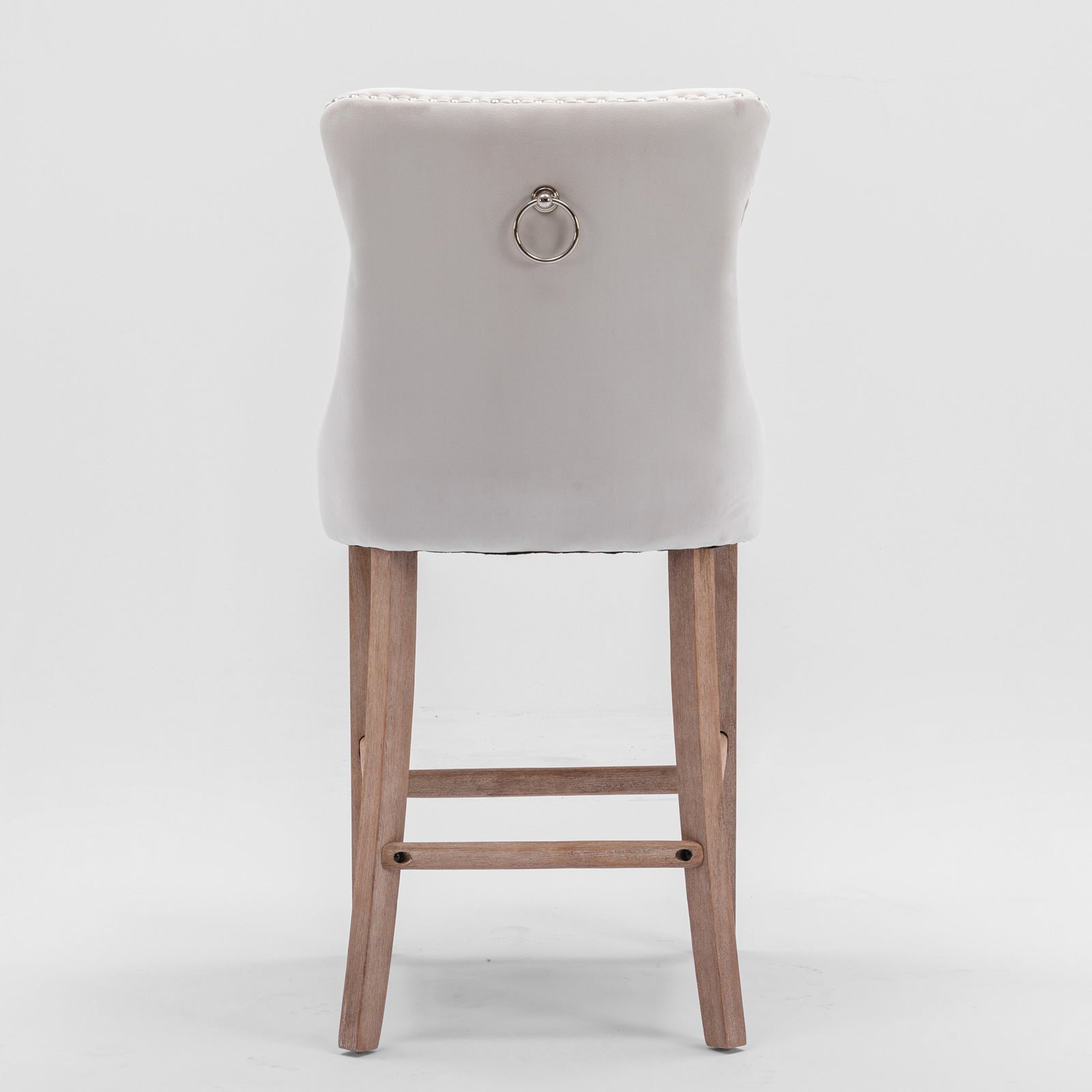 Light gray velvet bar stool with ring pull and tufted back