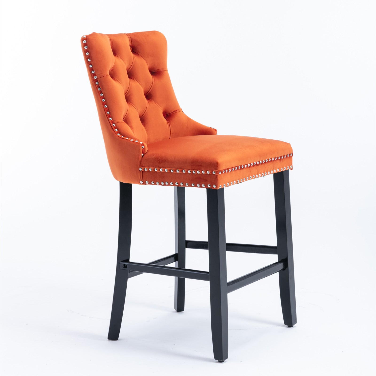 Orange velvet bar stool with tufted back and silver nailhead trim
