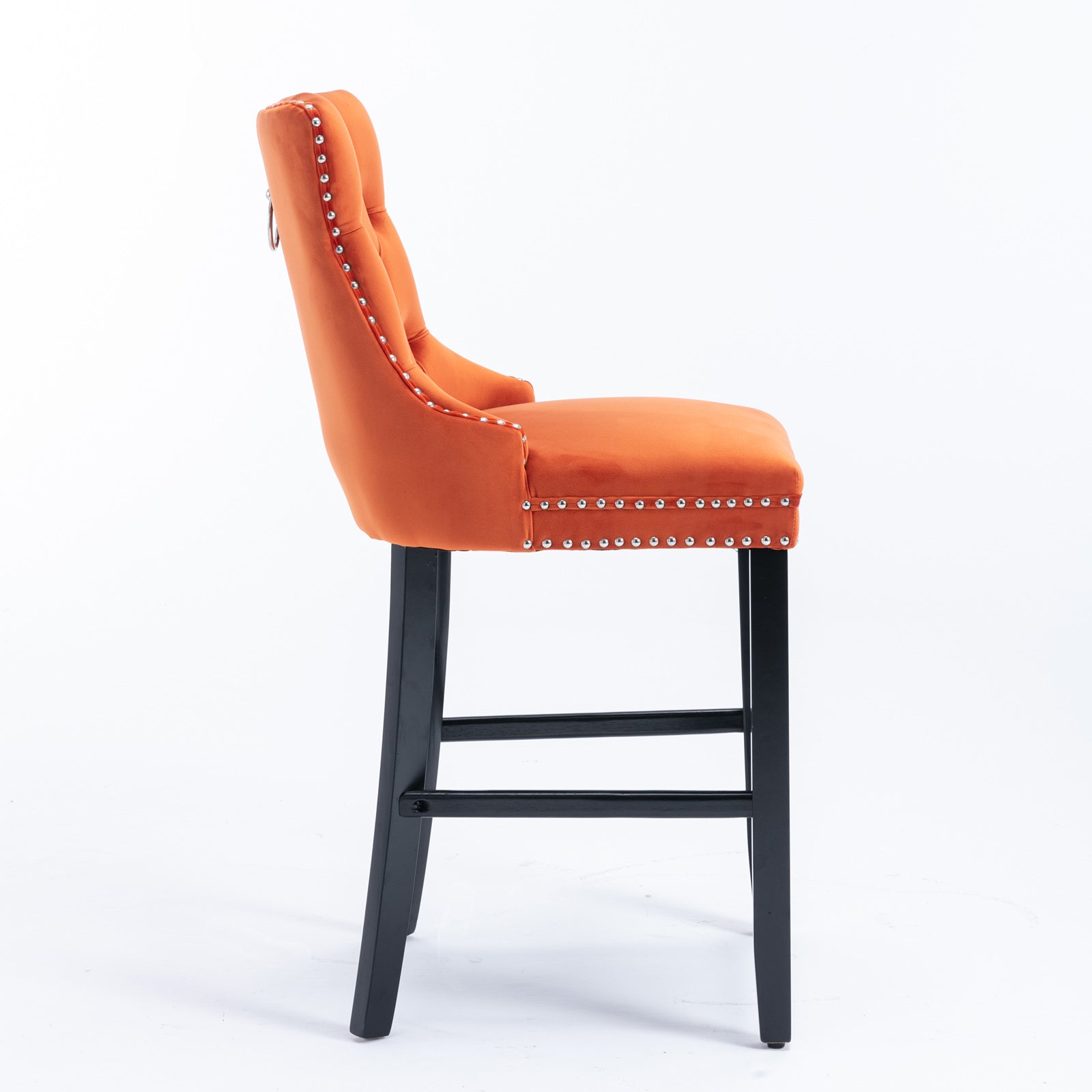 Orange velvet bar stool with tufted back and silver nailhead trim